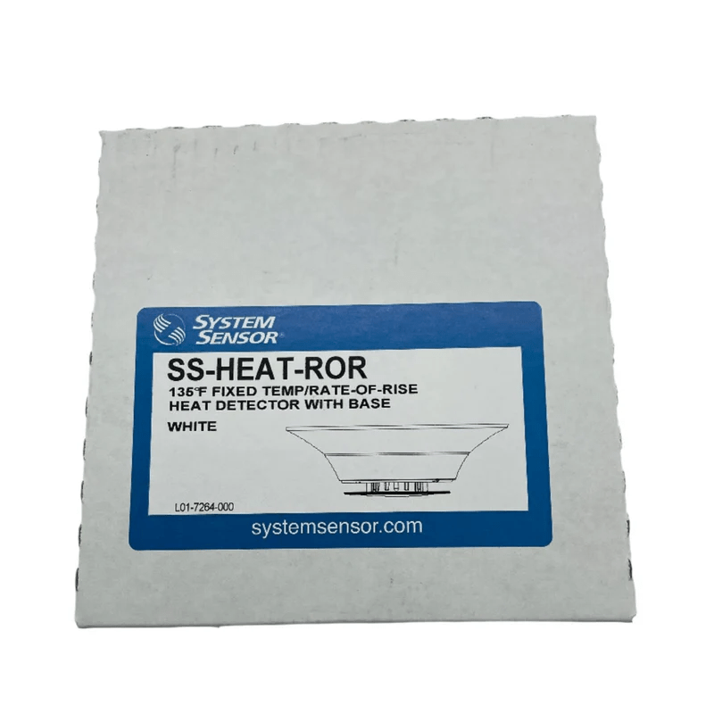 System Sensor SS-HEAT-ROR heat detector with remote reset button, mounted on a wall in a commercial setting.