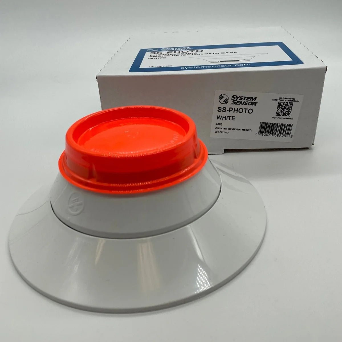 System Sensor SS-PHOTO photoelectric smoke detector with white plastic housing and mounting bracket.
