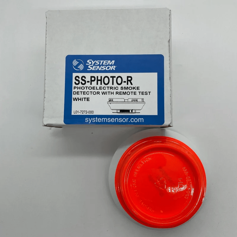 System Sensor SS-PHOTO-R photoelectric smoke detector mounted on ceiling with wiring visible.