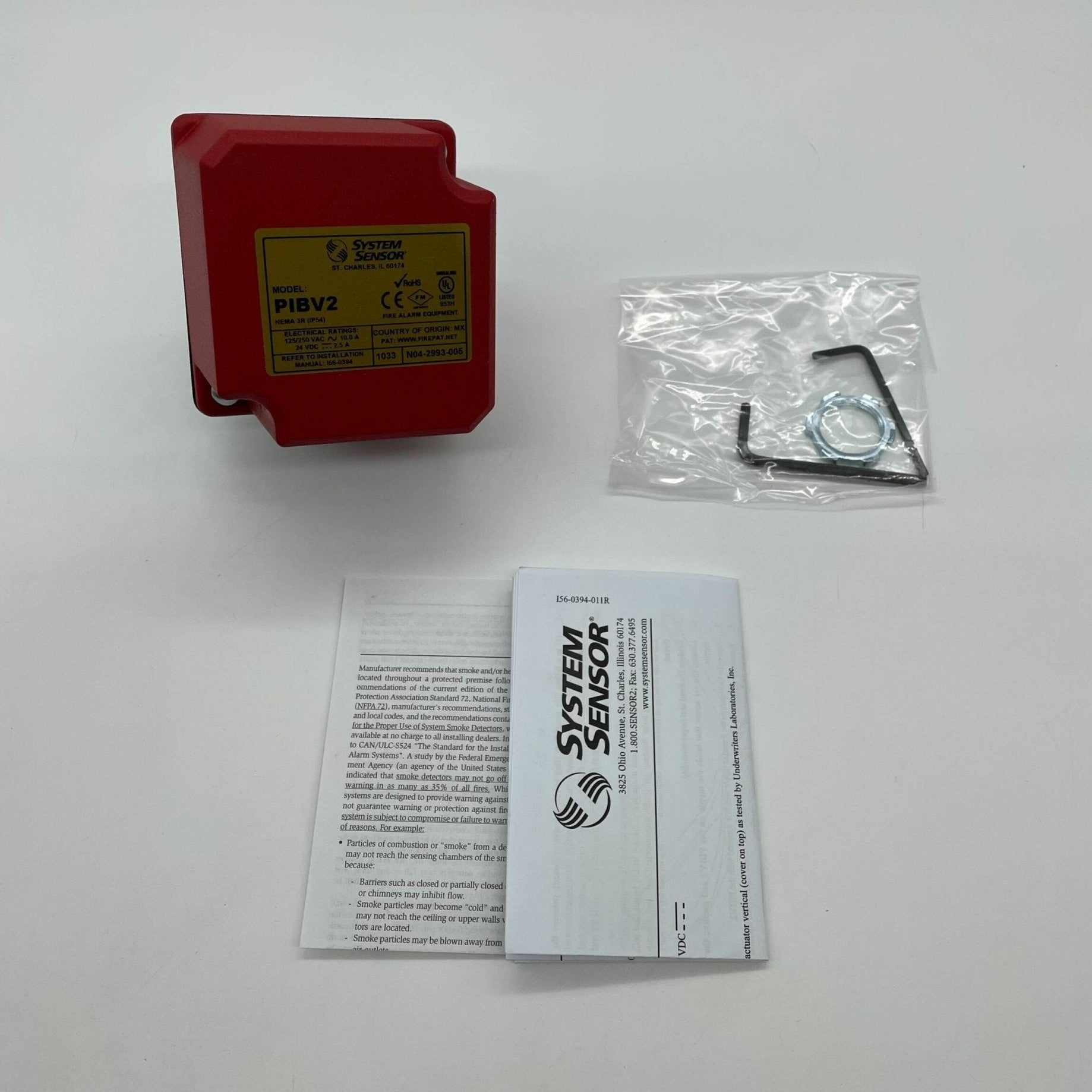 System Sensor PIBV2 fire alarm with black housing and test button, designed for fire detection and safety monitoring.