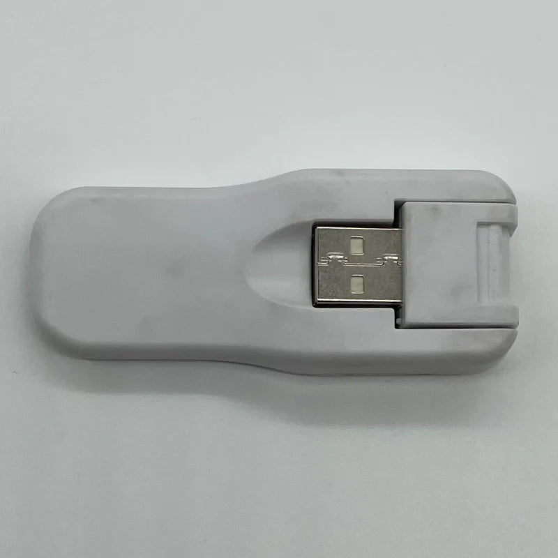 System Sensor W-USB wireless communication device with USB connection, used for integrating fire alarm systems and security networks.