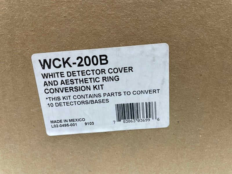 System Sensor WCK-200B wall mount enclosure with cover and wiring components, used for fire alarm system connections.