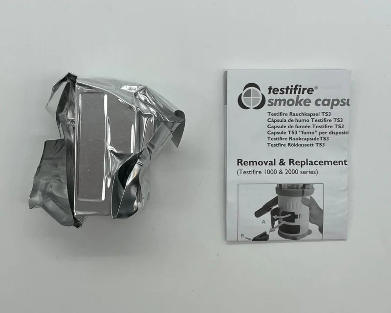 Testifire TS3 portable smoke testing device with display screen and control buttons, used for fire safety system testing.