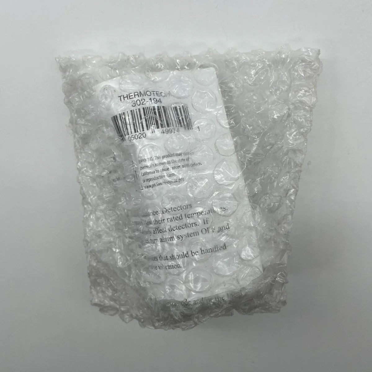 Thermotech 302-194 heat detector for rate anticipation, internal use, with a compact design and temperature sensing components.