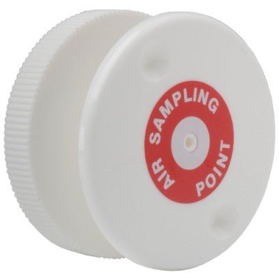 Vesda PIP-015 fire alarm detector mounted on wall, featuring sensor and wiring connections, in a clean industrial setting.