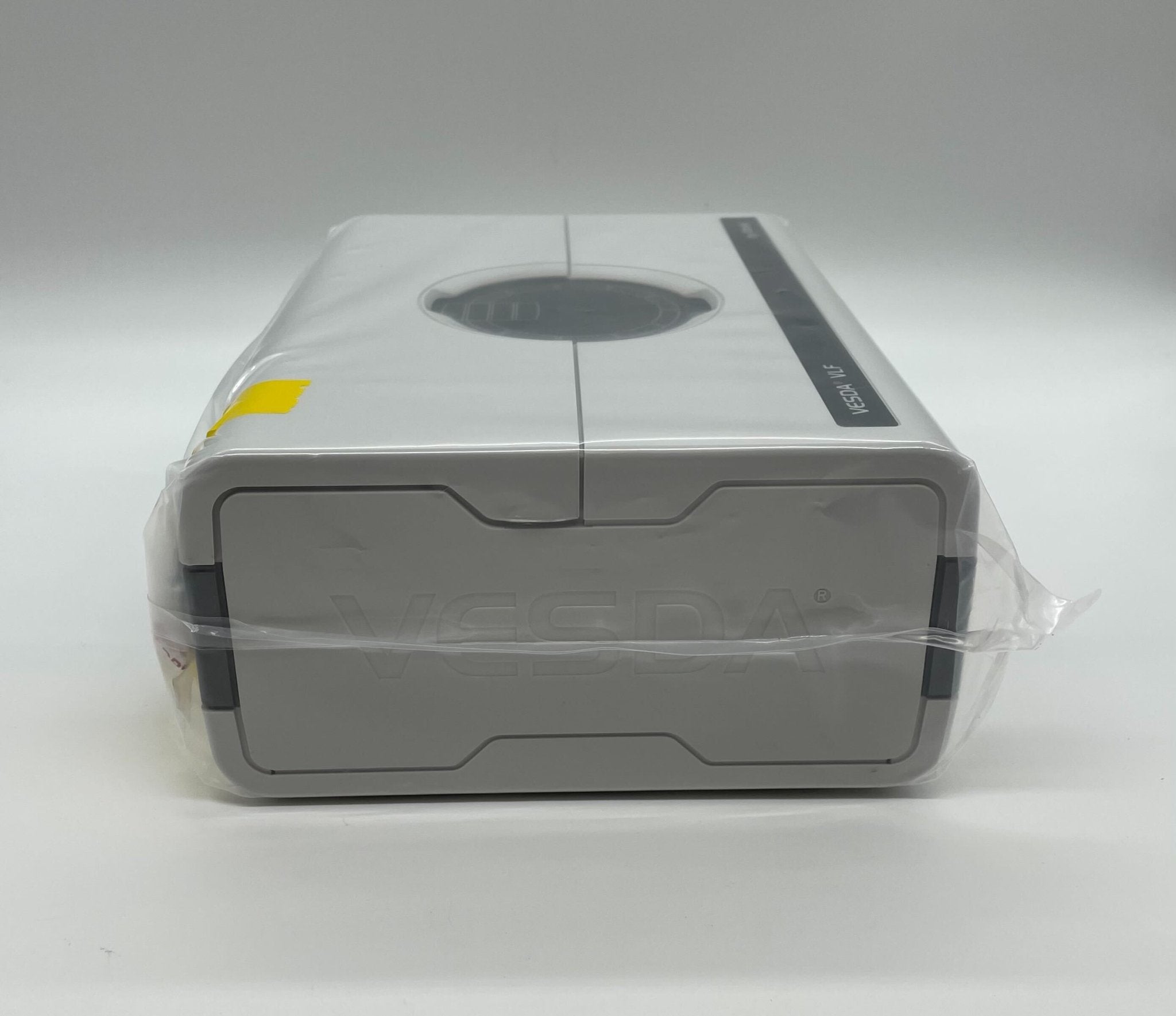 Vesda VLF-250-00 smoke detector, VESDA brand, mounted on ceiling with electronic components visible.