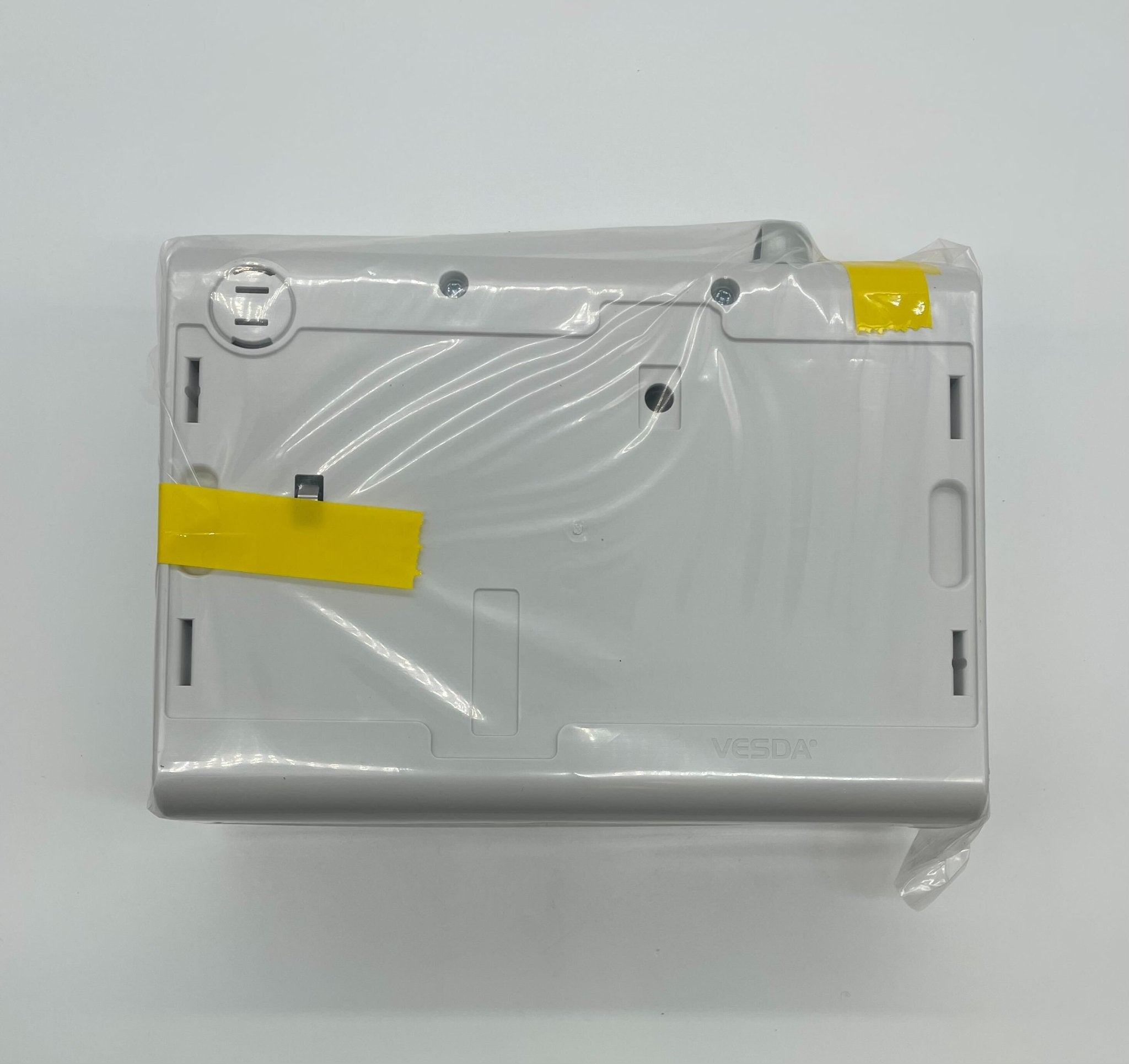 Vesda VLF-250-00 smoke detector mounted on ceiling, black cylindrical device for fire detection and safety.