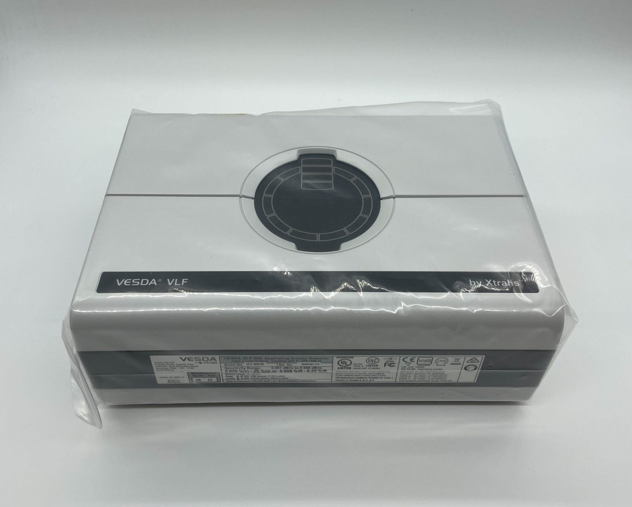Vesda VLF-500 smoke detector by VESDA, mounted on ceiling, designed for early fire detection in commercial settings.