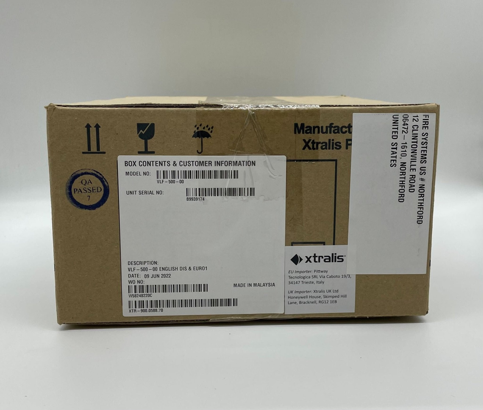 Vesda VLF-500 smoke detector mounted on ceiling, black rectangular sensor for fire detection and air sampling system.