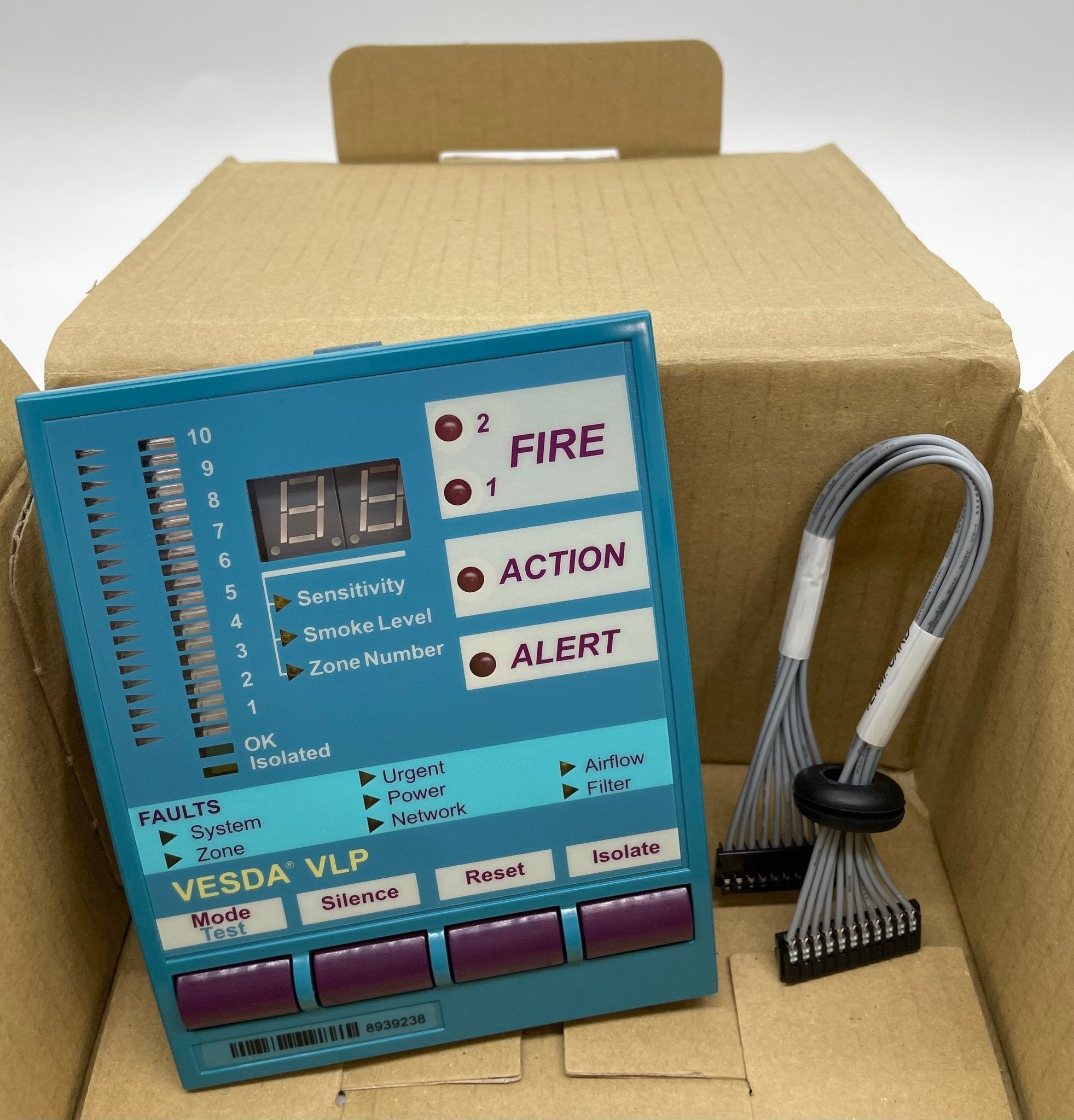 Vesda VSP-002 VLP Display Module mounted on a panel, showing electronic interface and connection ports for fire detection systems.