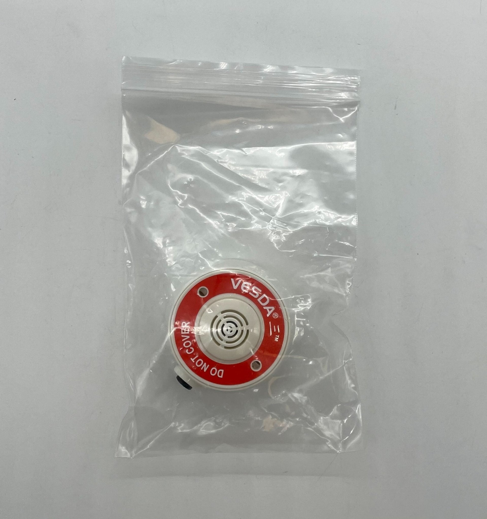 VESDA VSP-983-W fire alarm device by VESDA, mounted on wall, with LED indicators and sensor components visible.