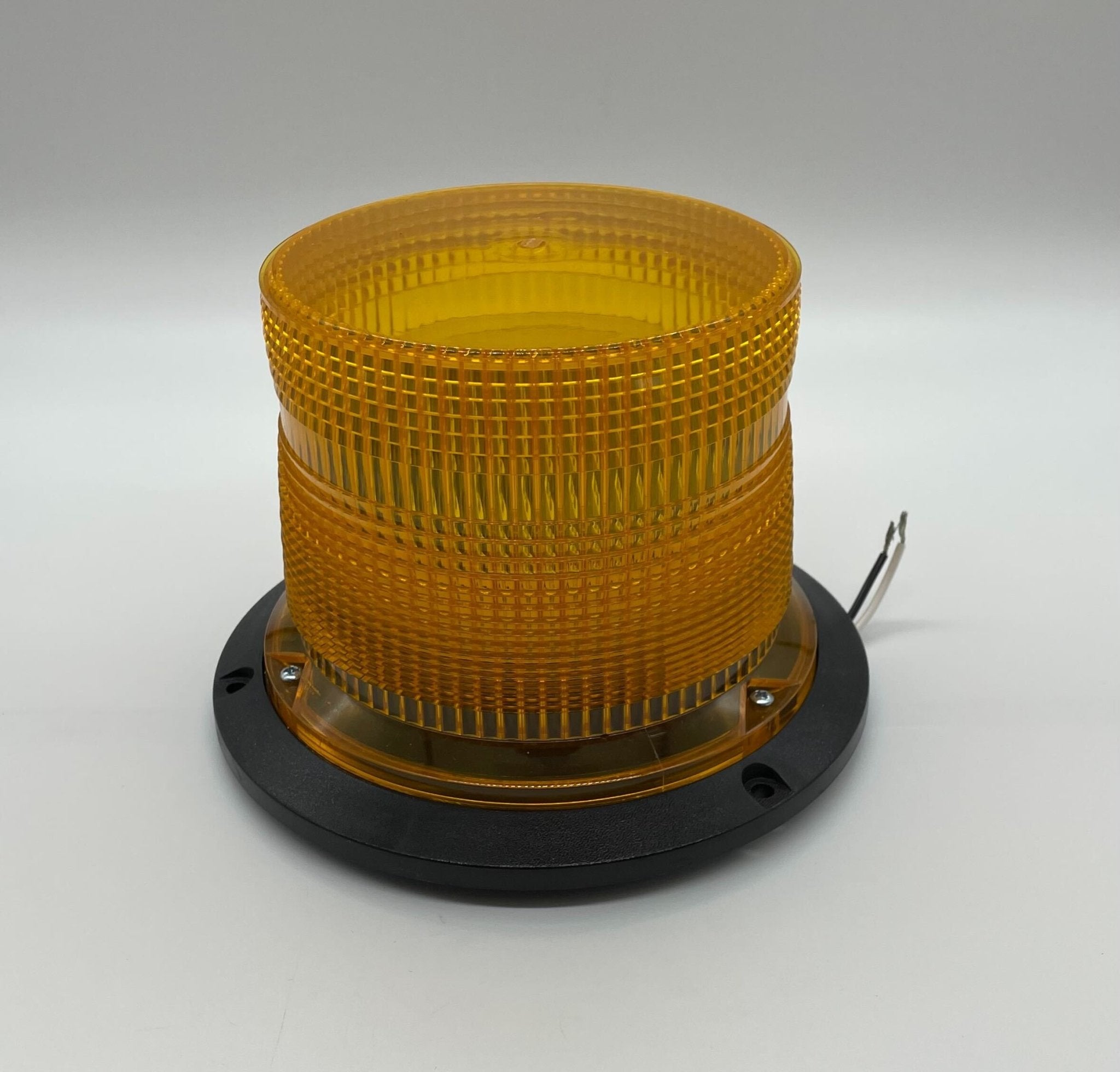Eaton Wheelock AC-MAX-A strobe light, visible close-up showing its design and mounting features.