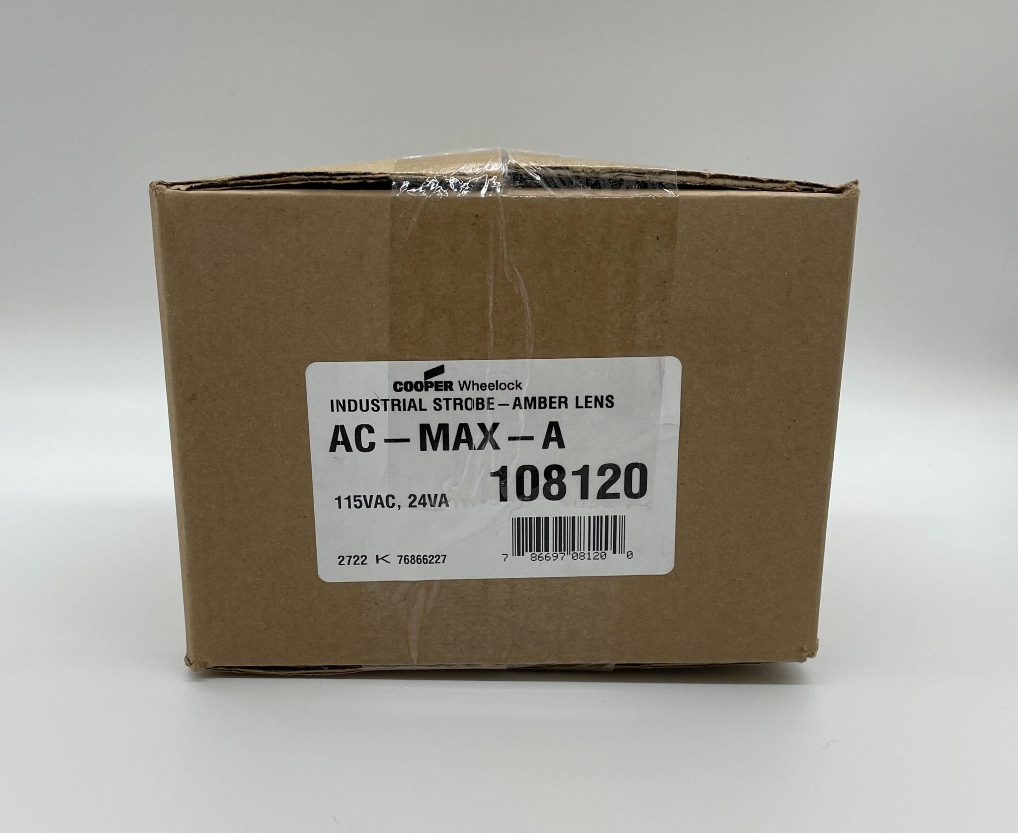 Eaton Wheelock AC-MAX-A strobe light with clear lens and mounting bracket for emergency signaling and alert systems.