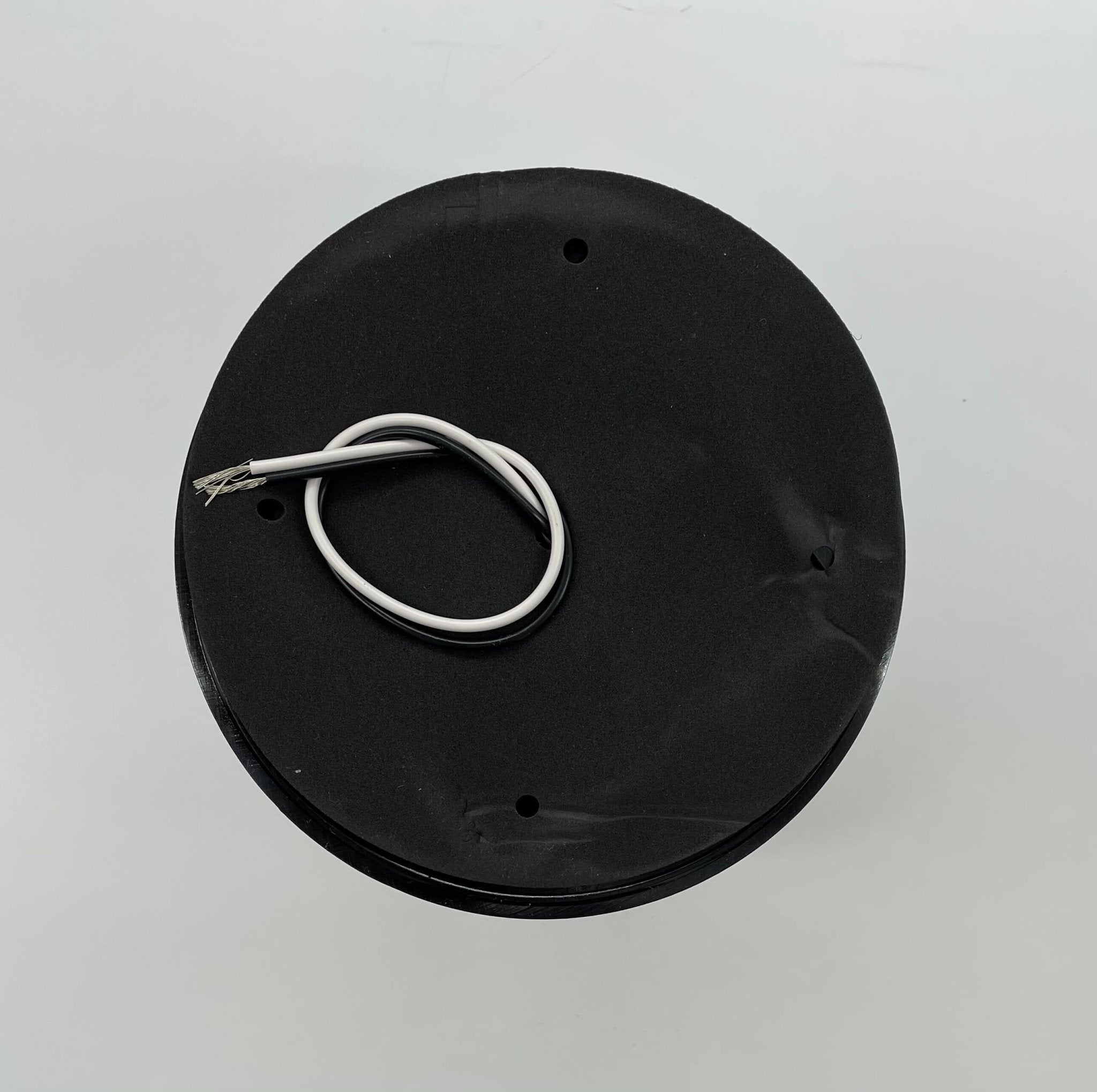 Eaton Wheelock AC-MAX-R fire alarm with red housing and mounting bracket, designed for fire safety systems.
