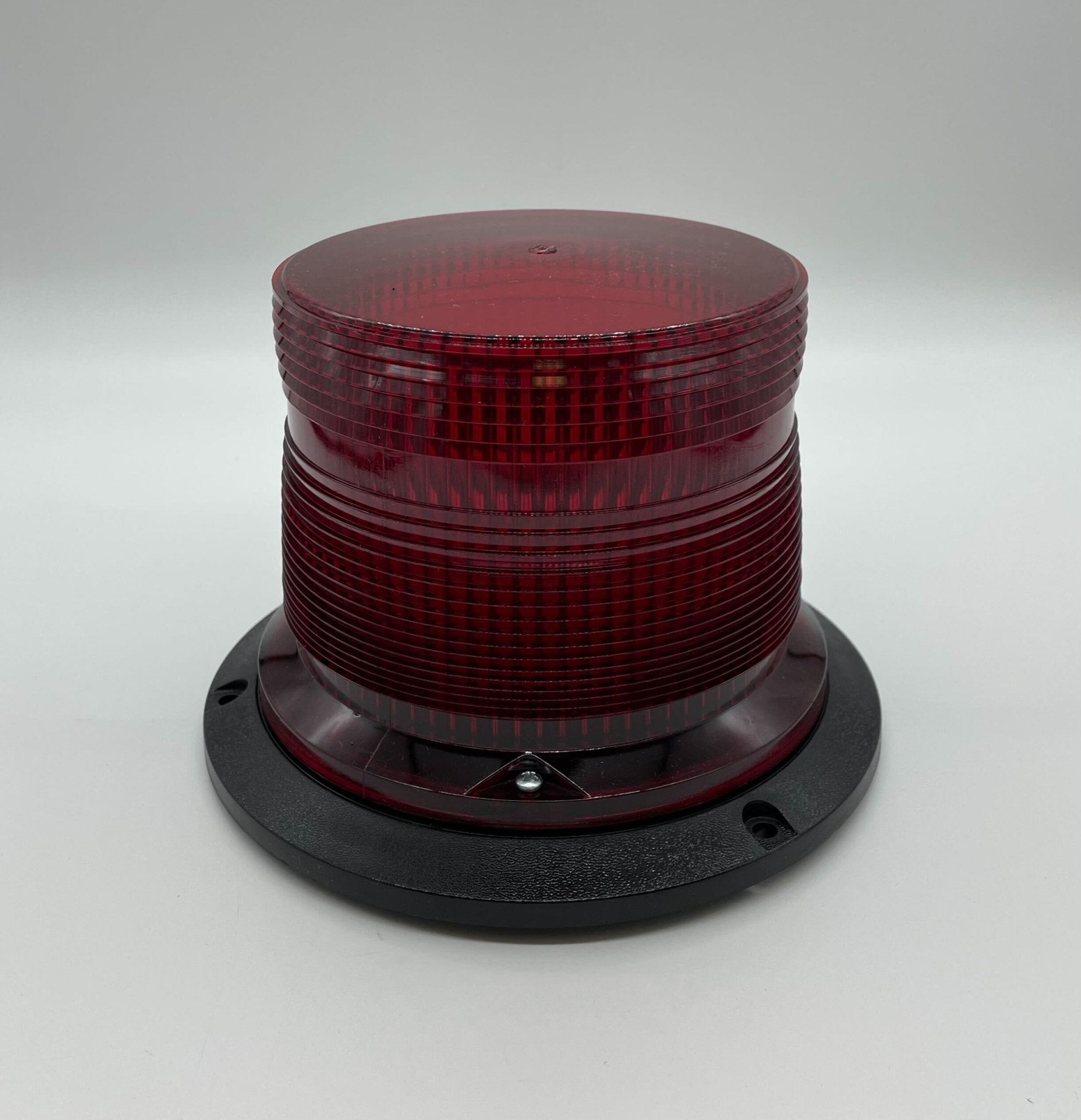 Eaton Wheelock AC-MAX-R fire alarm with a black rectangular detector and mounting base, designed for fire safety systems.