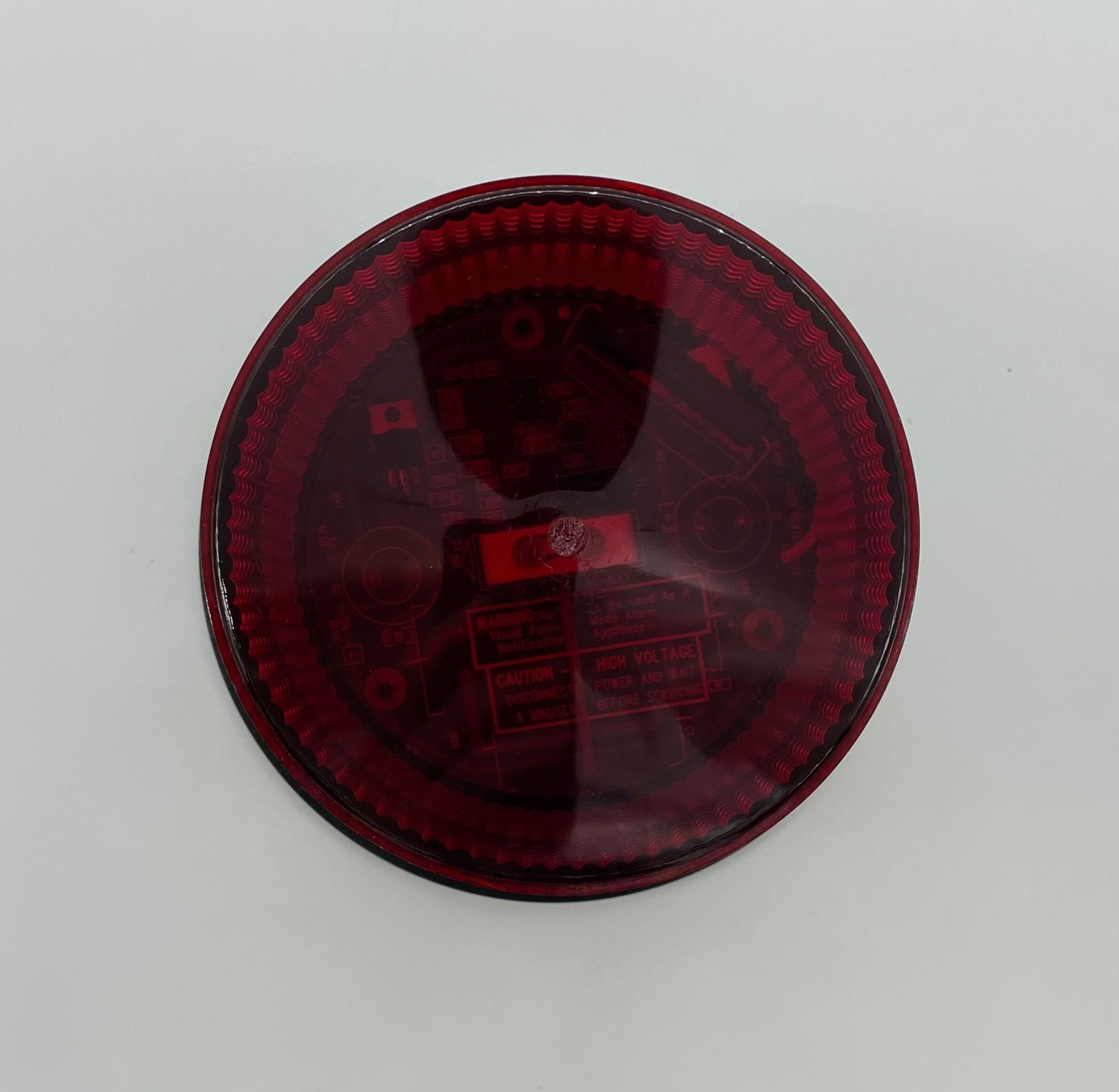 Eaton Wheelock AC-MAX-R fire alarm with mounting bracket and wiring, designed for commercial fire detection systems.