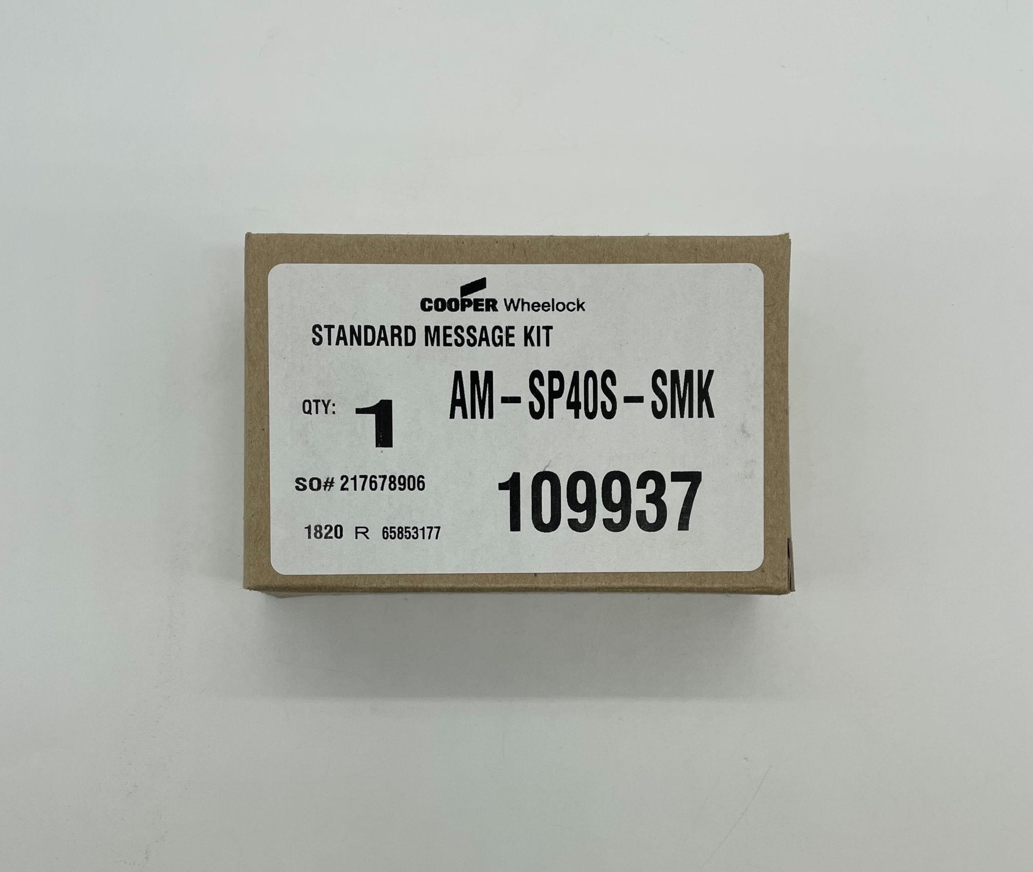 Eaton Wheelock AM-SP40S-SMK fire alarm speaker with smoke detector, mounted on wall in a commercial setting