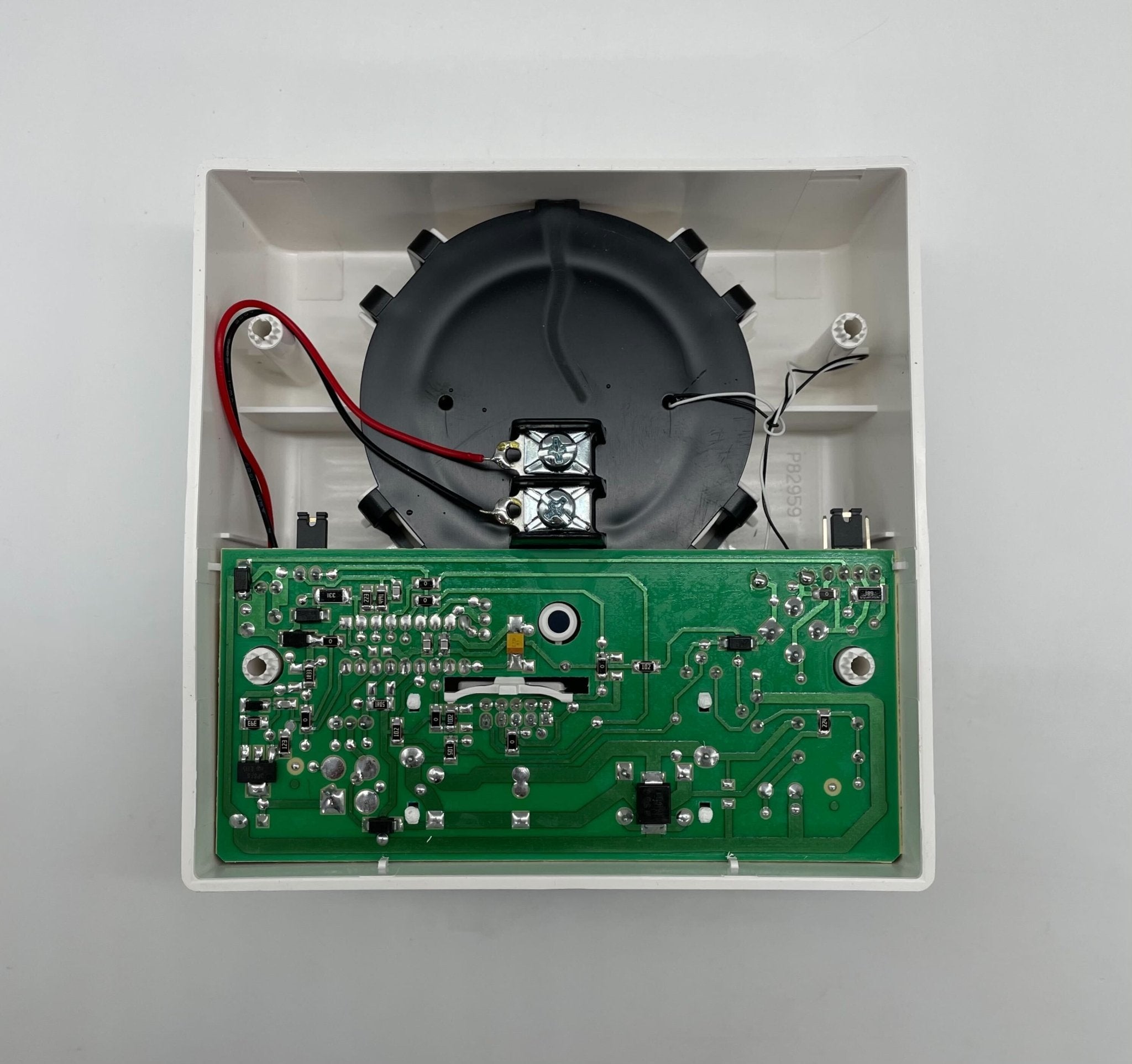 Eaton Wheelock ASB-24MCW-NW strobe light with white lens, mounted on a ceiling for emergency signaling and alerting.