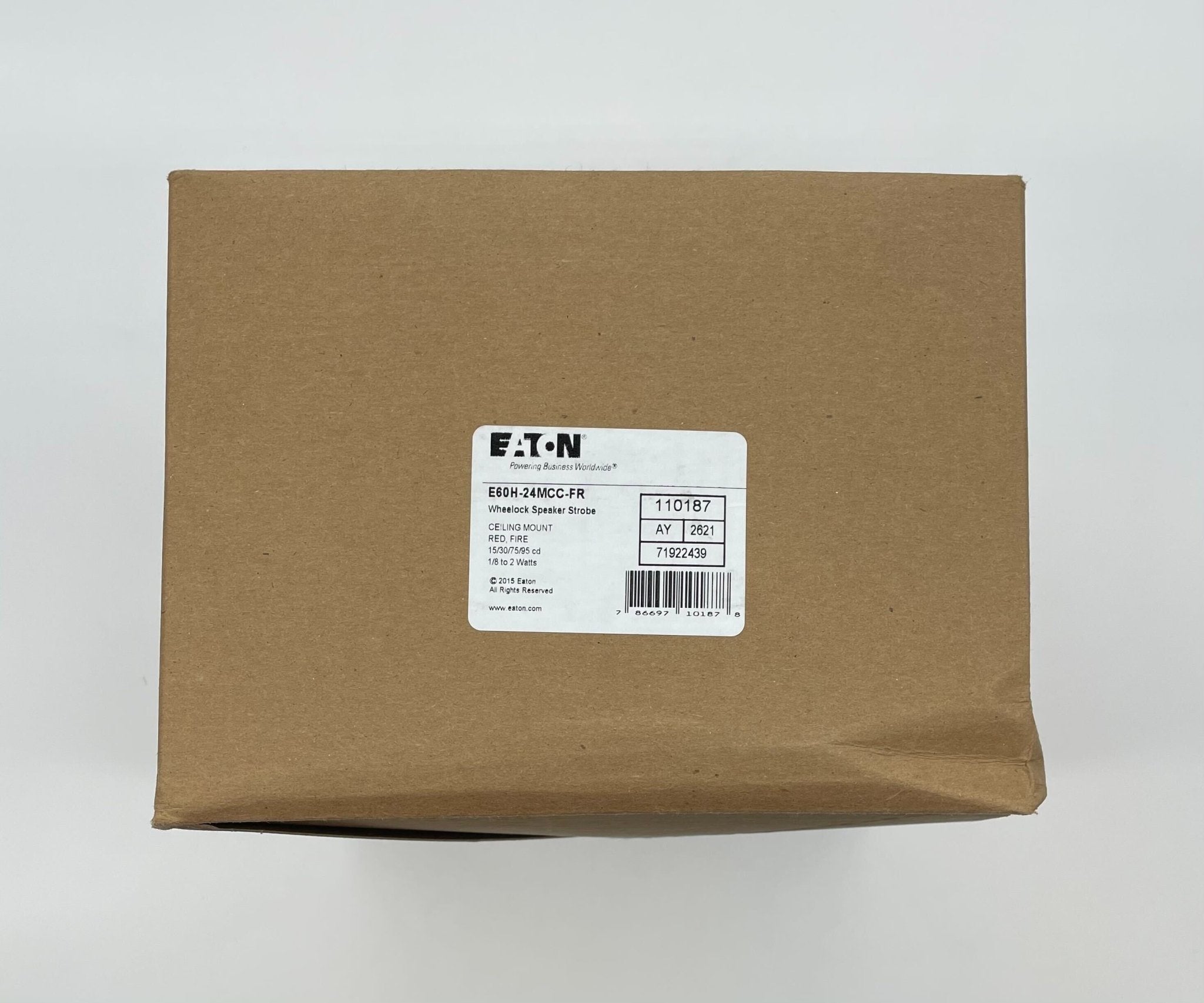 Eaton Wheelock E60H-24MCC-FR speaker strobe with red housing and mounting bracket, designed for fire alarm notification.