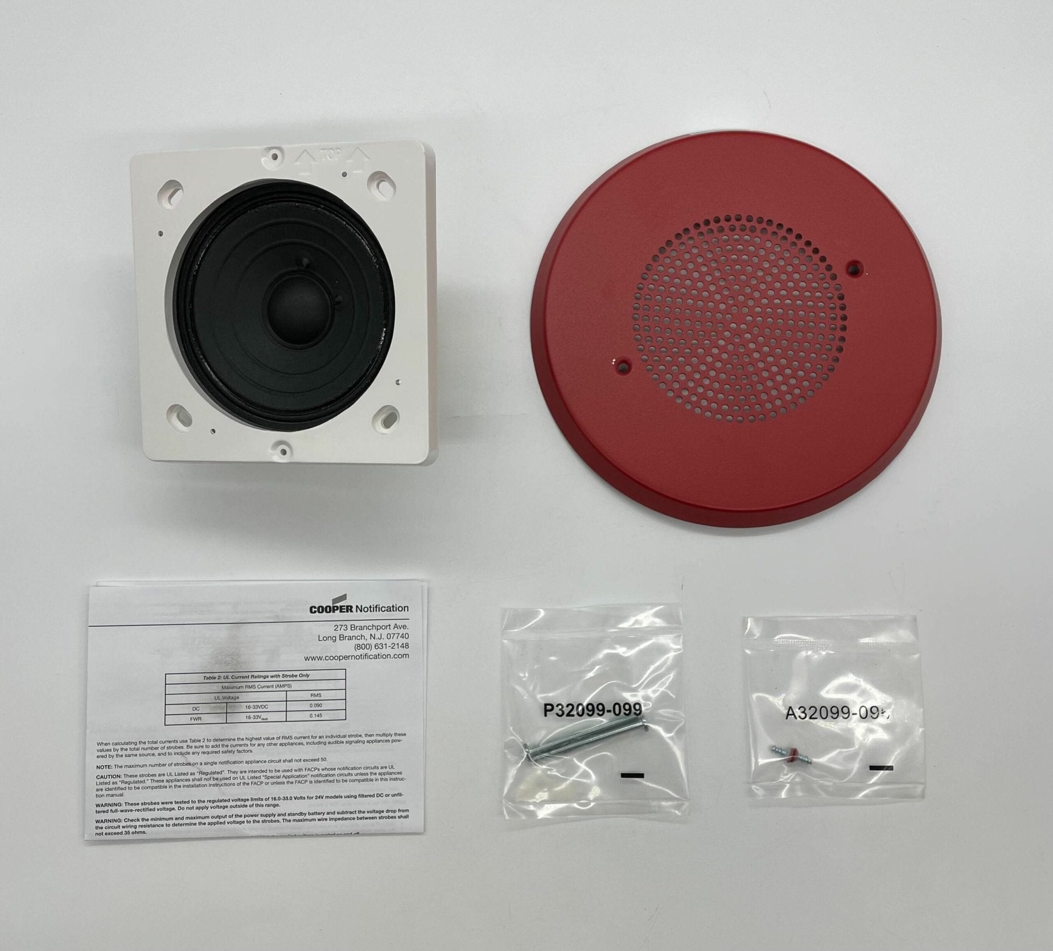Eaton Wheelock E90-R speaker mounted on wall, showcasing its compact design and grille for professional audio installation.