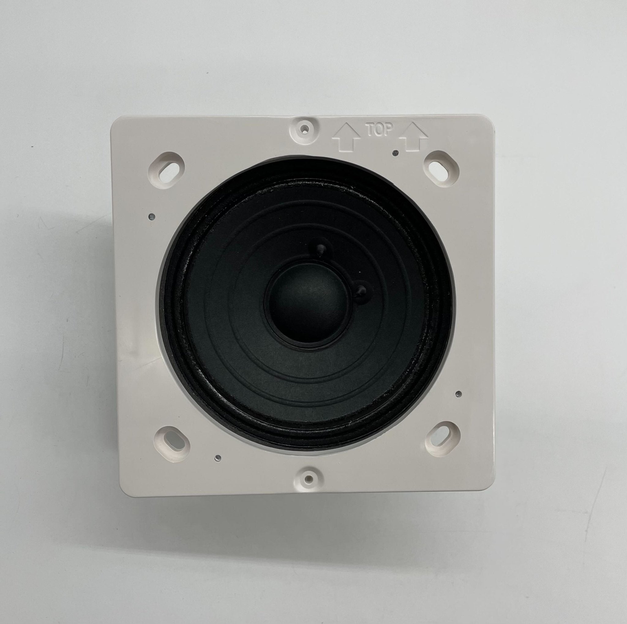 Eaton Wheelock E90-R speaker with white grille and mounting bracket, designed for commercial audio installations