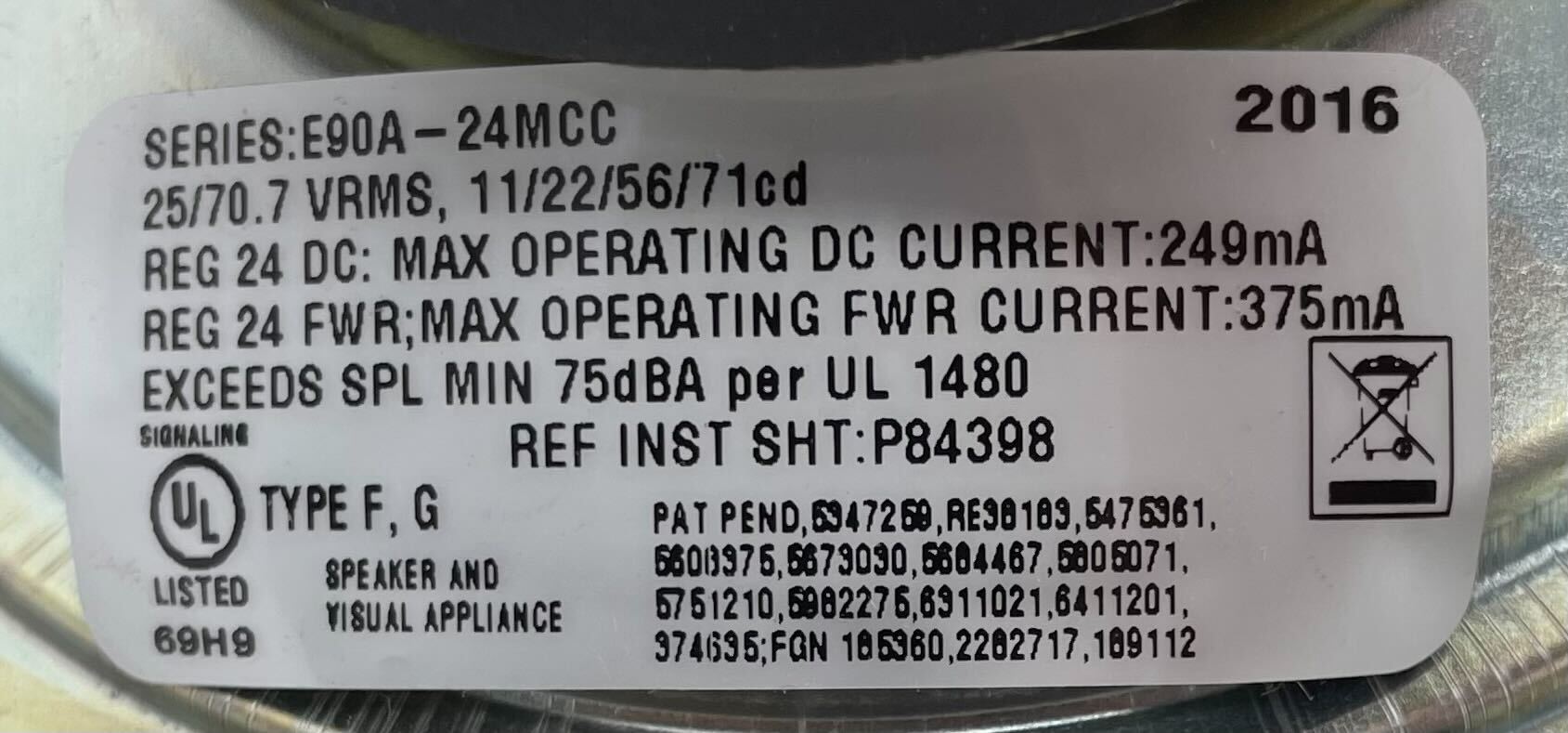 Eaton Wheelock E90A-24MCC-ALW speaker strobe with red lens and mounting hardware, designed for alarm notification systems.