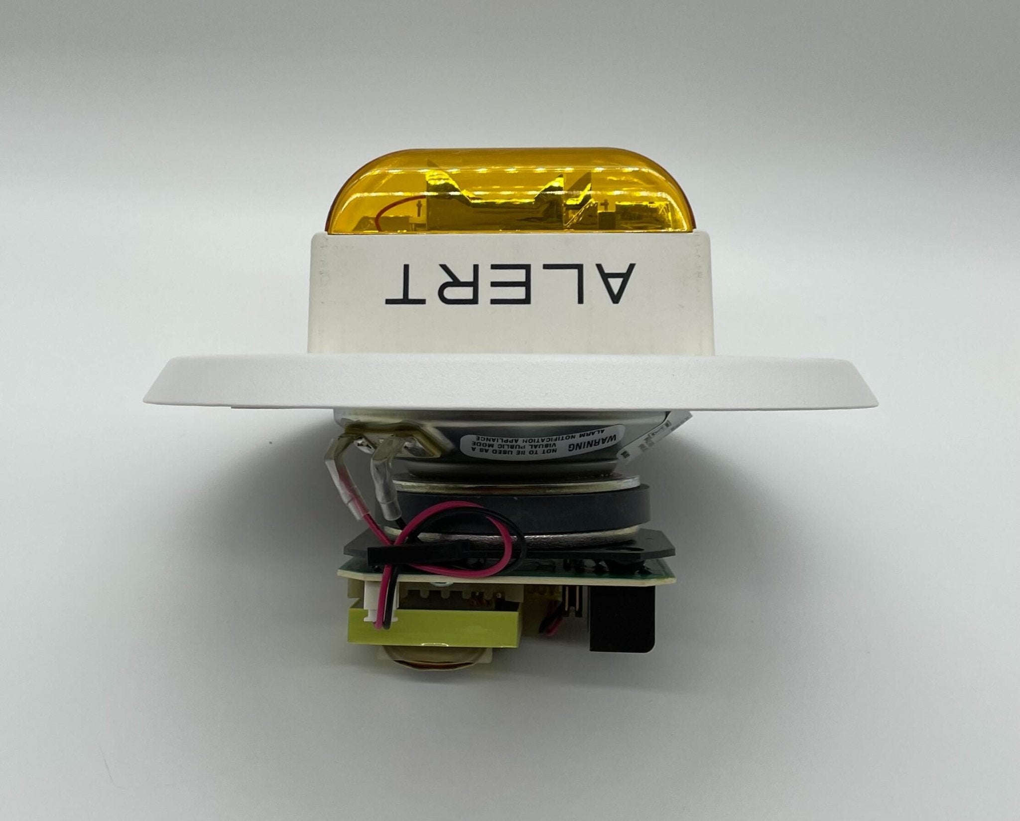 Eaton Wheelock E90A-24MCC-ALW speaker strobe with red lens and mounting base, designed for fire alarm notification appliances.