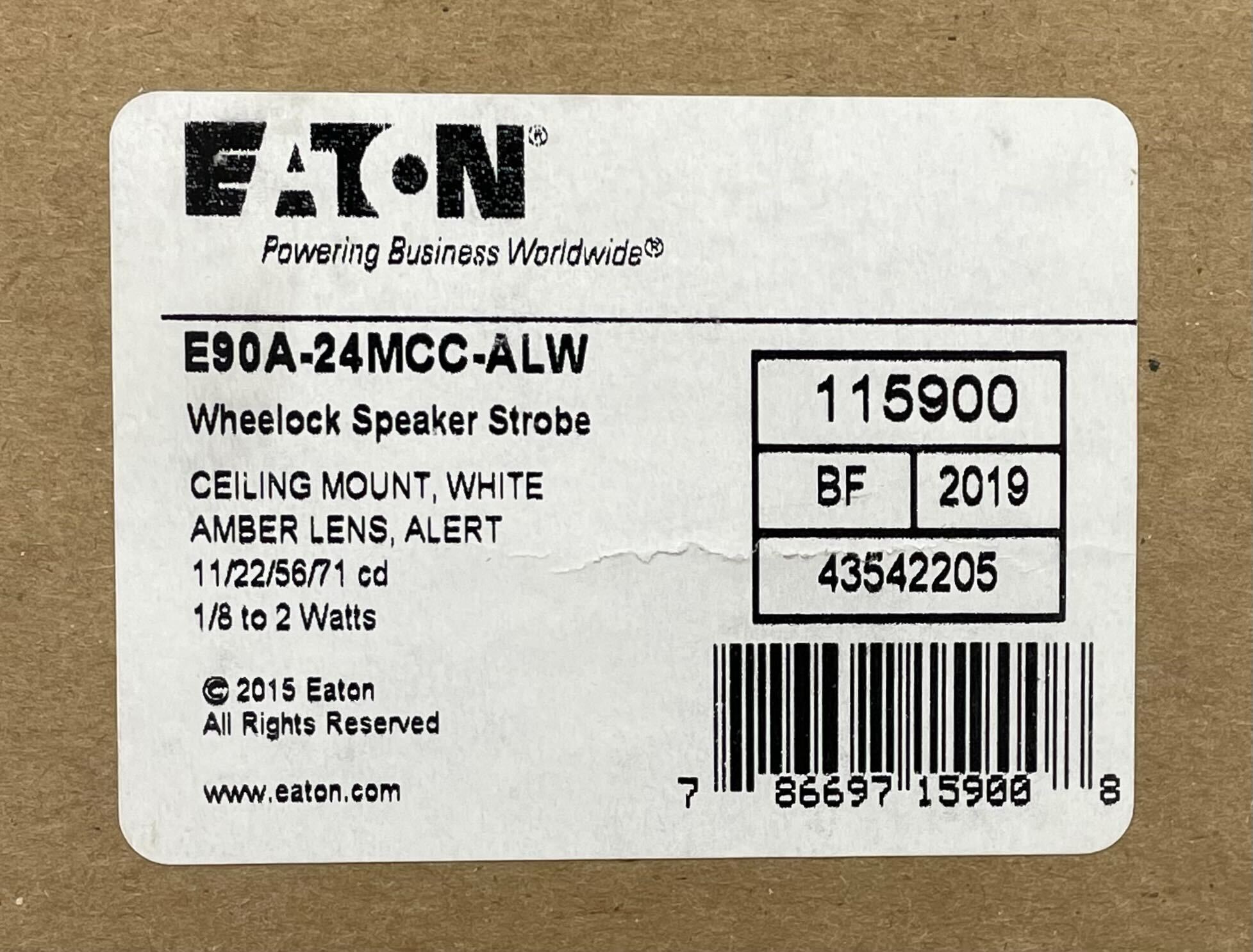 Eaton Wheelock E90A-24MCC-ALW speaker strobe with red and white housing, mounted on a ceiling in a commercial space.