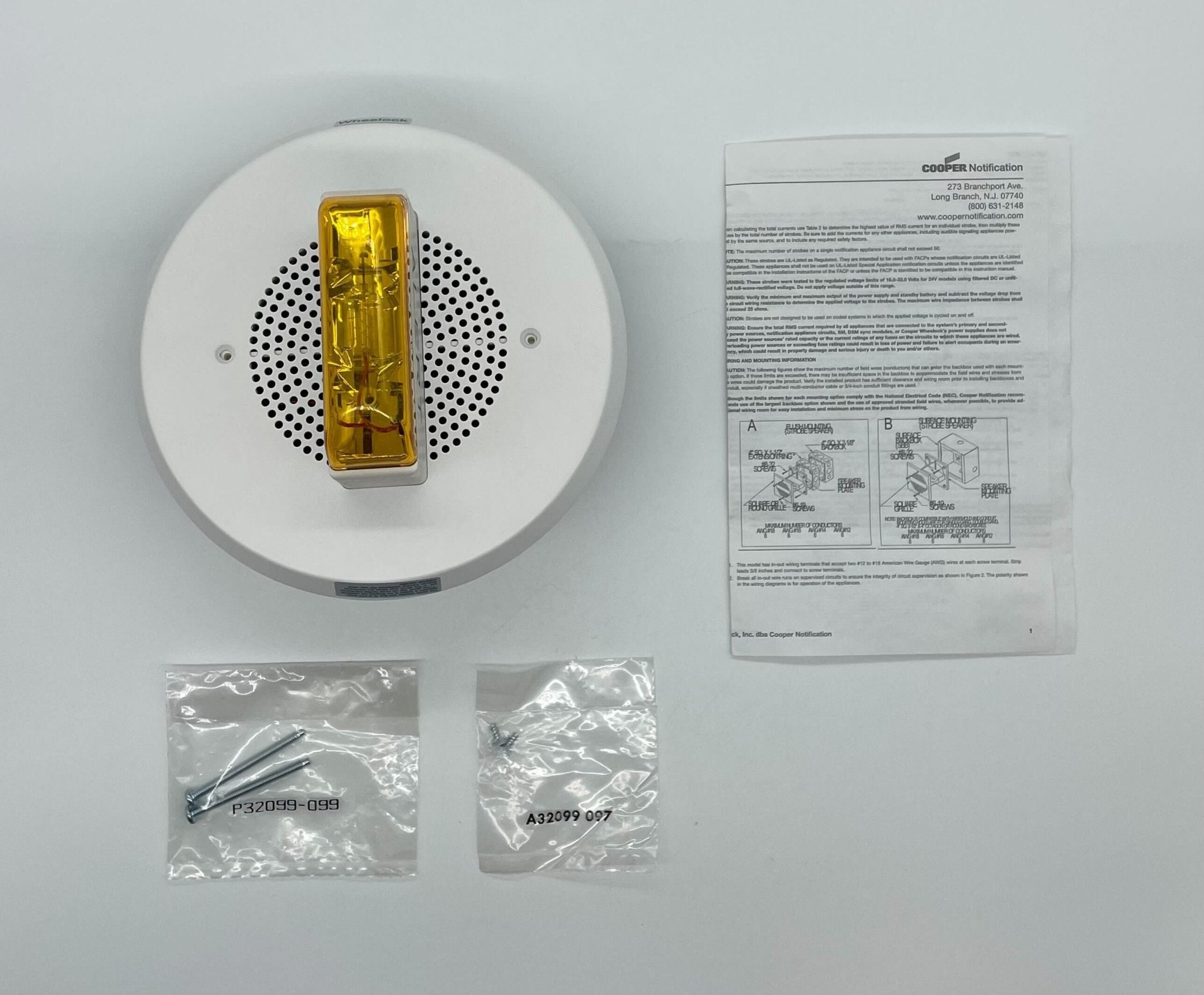 Eaton Wheelock E90A-24MCC-ALW speaker strobe alarm device mounted on wall, with clear visibility of the product model and brand.