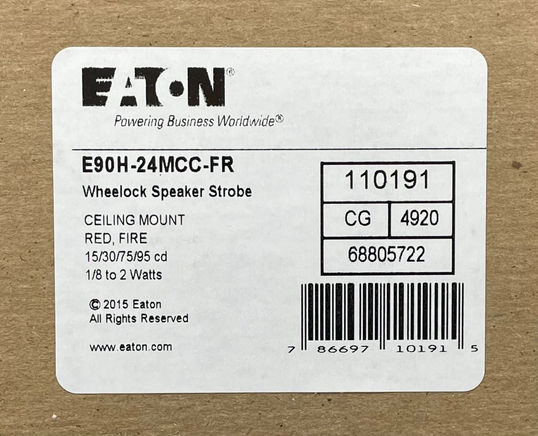 Eaton Wheelock E90H-24MCC-FR speaker strobe with red housing and visible mounting hardware.