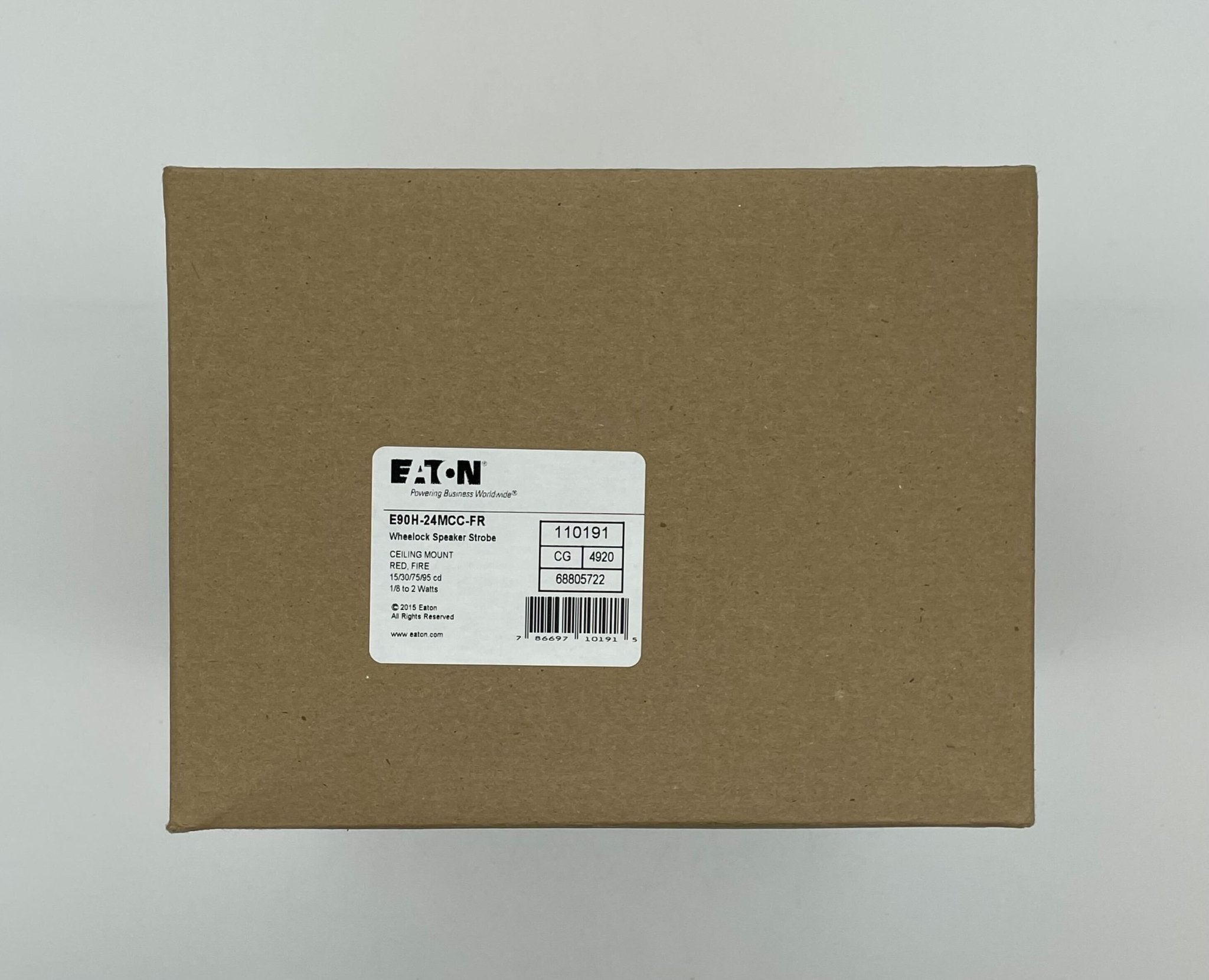 Eaton Wheelock E90H-24MCC-FR speaker strobe with red housing and mounting hardware, designed for fire alarm notification systems.