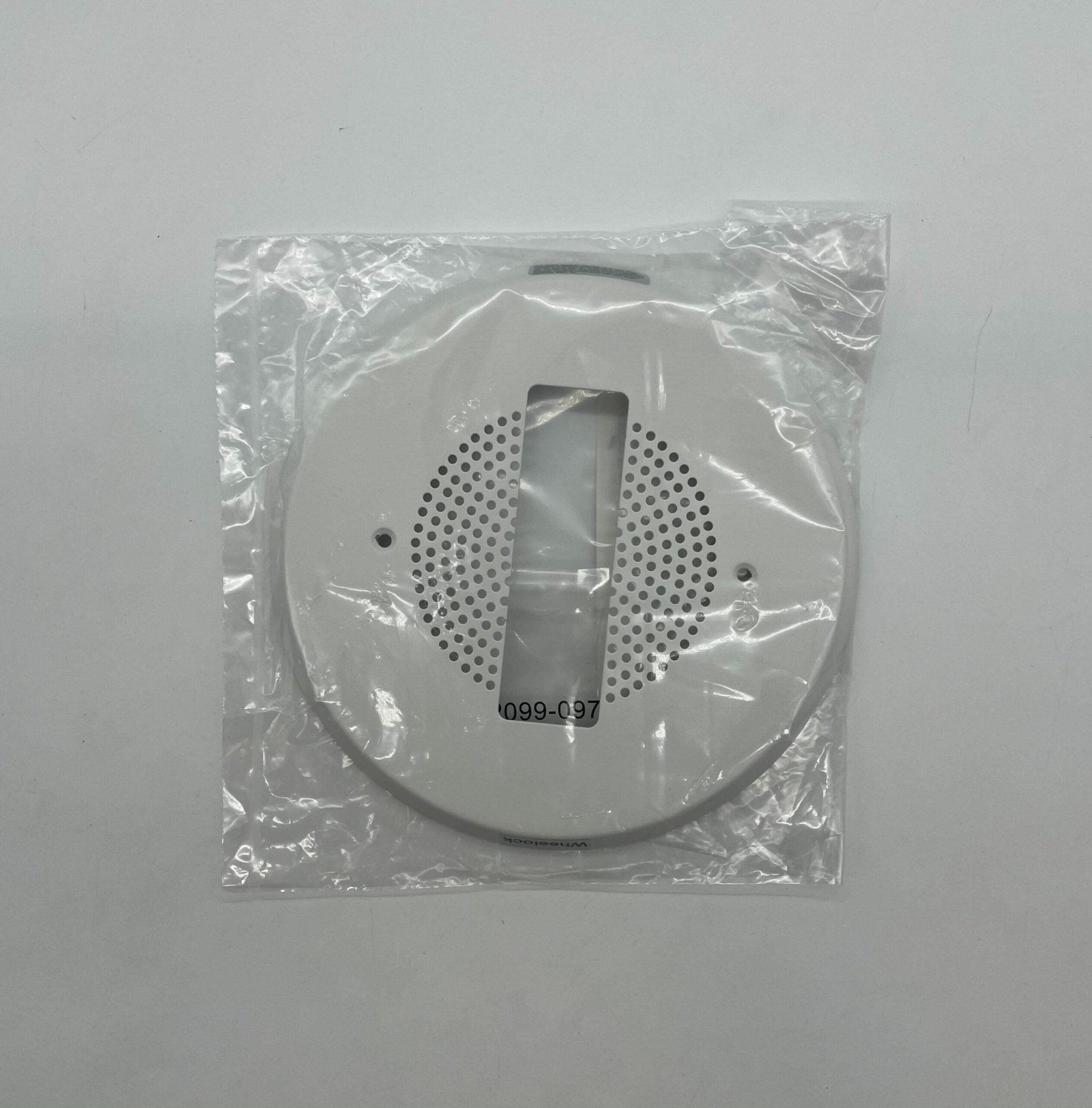 Eaton Wheelock ECHSG90-W fire alarm with white housing and mounting bracket, designed for commercial fire safety systems