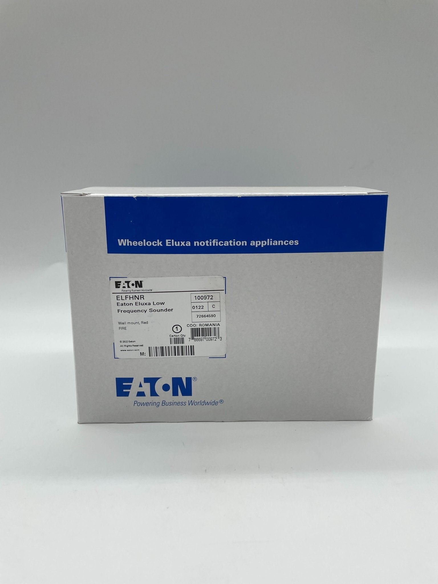Eaton Wheelock ELFHNR sounder with black housing and mounting bracket for industrial alarm signaling.