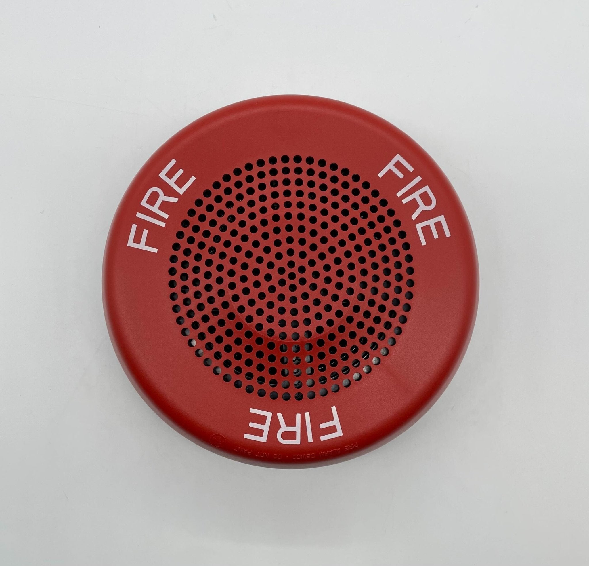 Eaton Wheelock ELFHNRC sounder with red housing and mounting bracket, designed for industrial fire alarm systems.