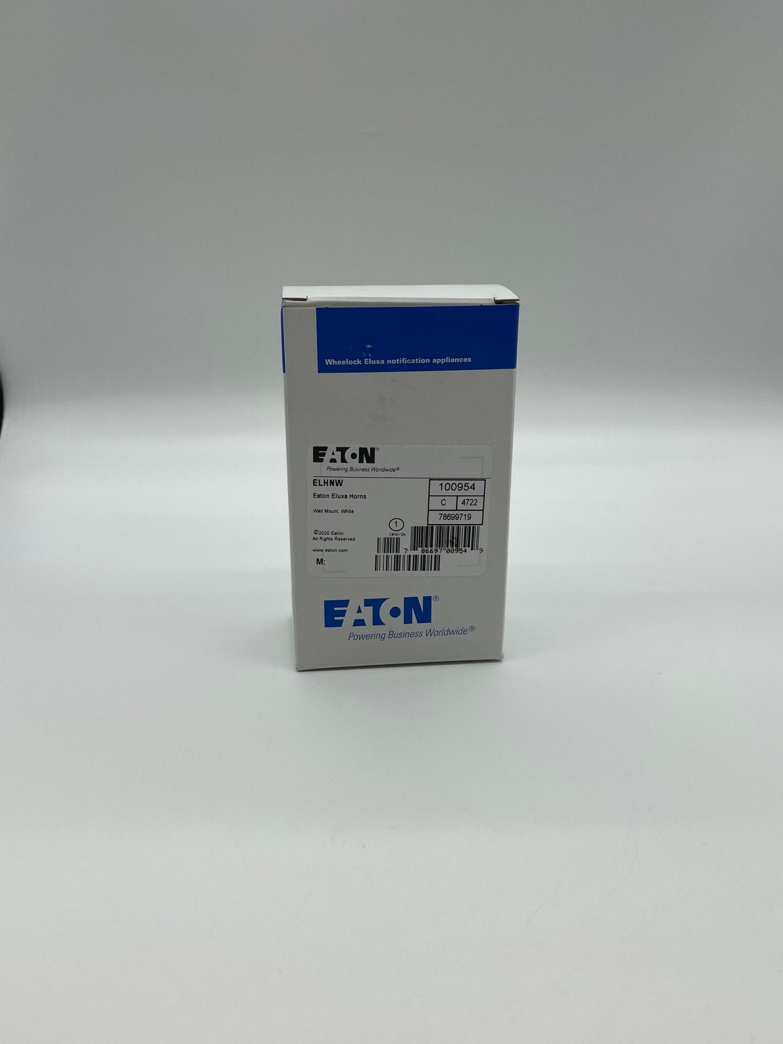 Eaton Wheelock ELHNW emergency lighting fixture with white finish, mounted on wall, designed for commercial safety applications