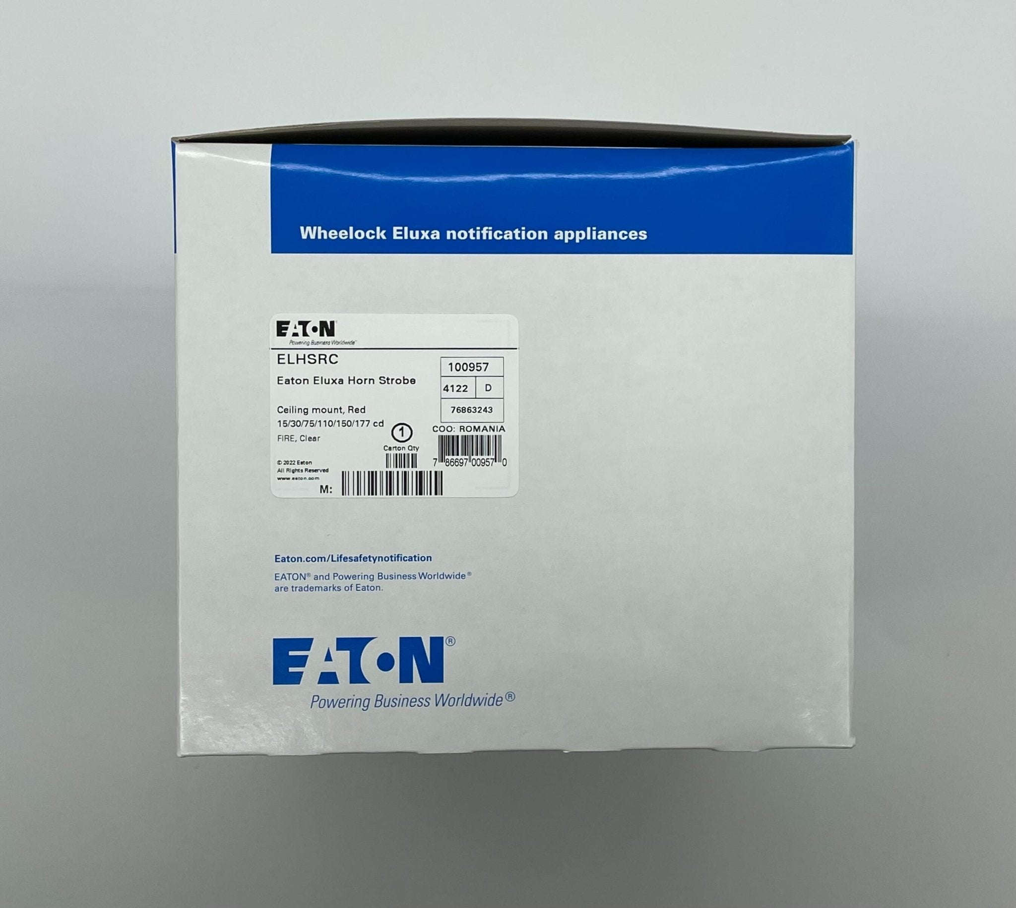 Eaton Wheelock ELHSRC horn strobe alarm device mounted on a wall, used for fire and emergency signaling.