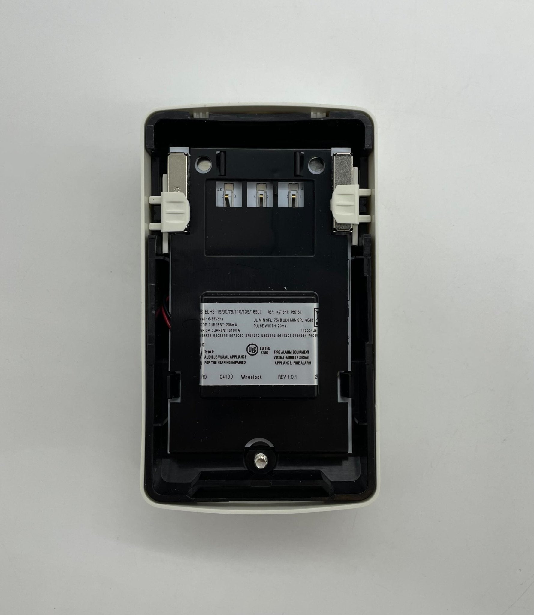 Eaton Wheelock ELHSW horn strobe alarm with red housing and mounting base, designed for fire and security alert systems.