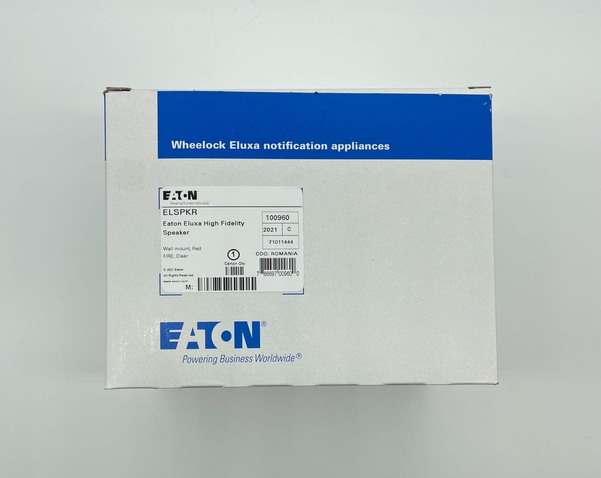 Eaton Wheelock ELSPKR speaker mounted with a grille and mounting bracket, designed for high-quality audio installation.