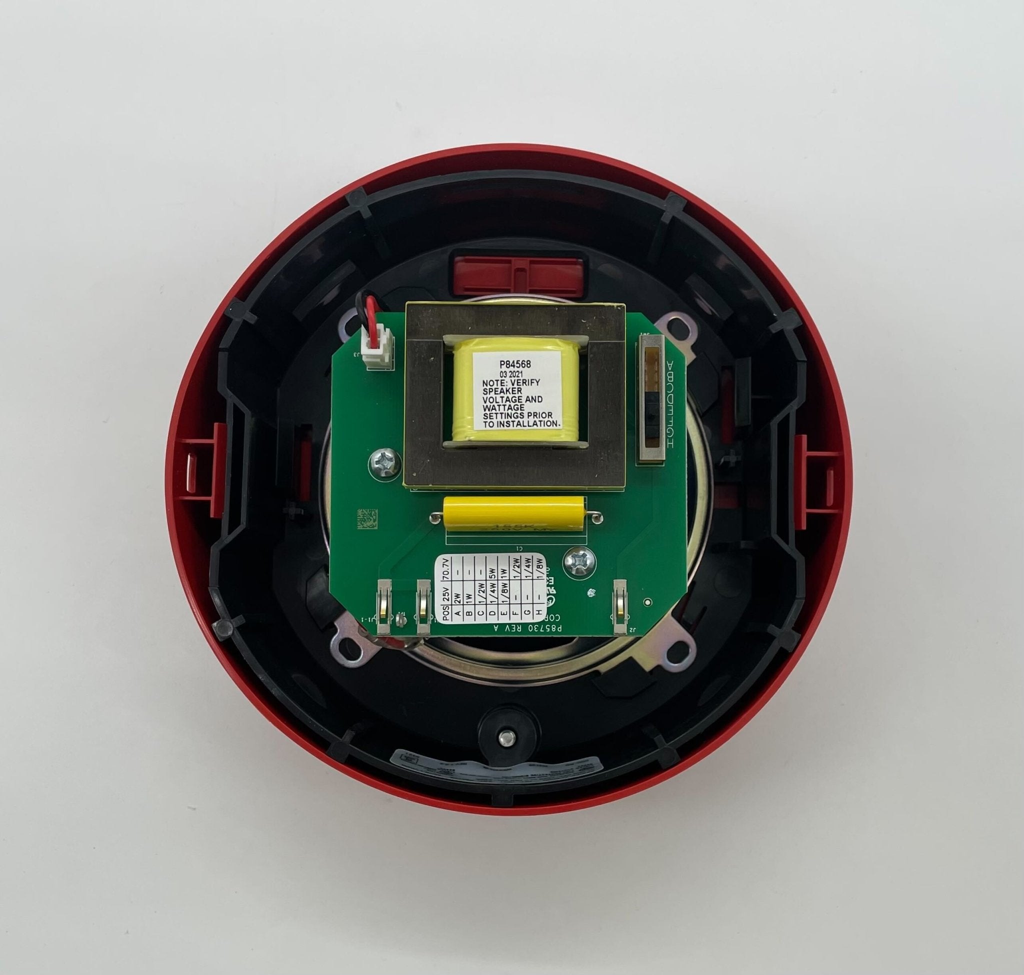 Eaton Wheelock ELSPKRC speaker mounted on wall, black speaker with grille, designed for commercial sound systems.
