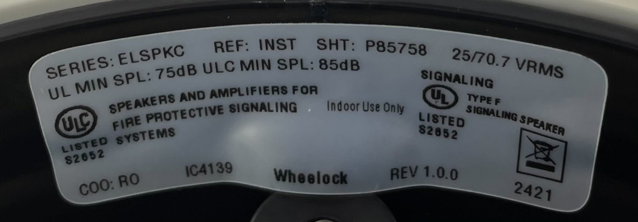 Eaton Wheelock ELSPKWC speaker with white grille and mounting bracket, designed for professional audio installations.