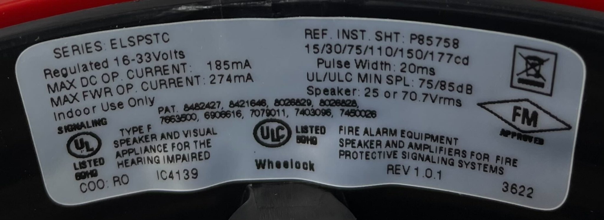 Eaton Wheelock Eluxa high fidelity speaker strobe with white housing and mounting bracket, designed for emergency alert systems.