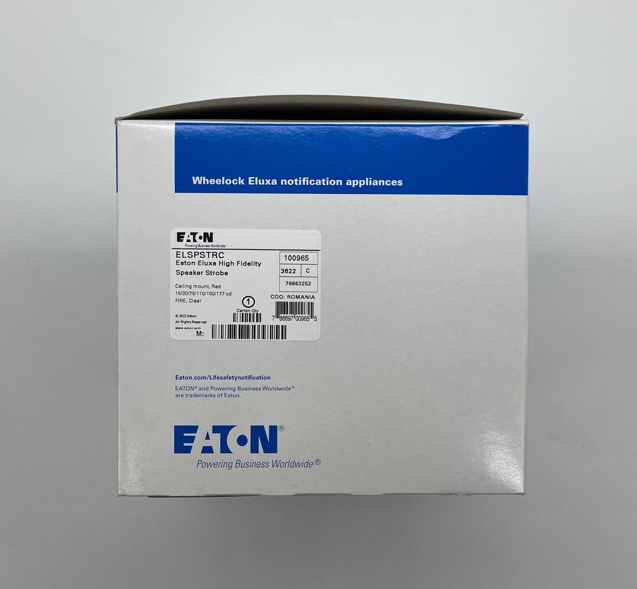 Eaton Wheelock Eluxa High Fidelity Speaker Strobe with red housing and mounting bracket for emergency alert systems.
