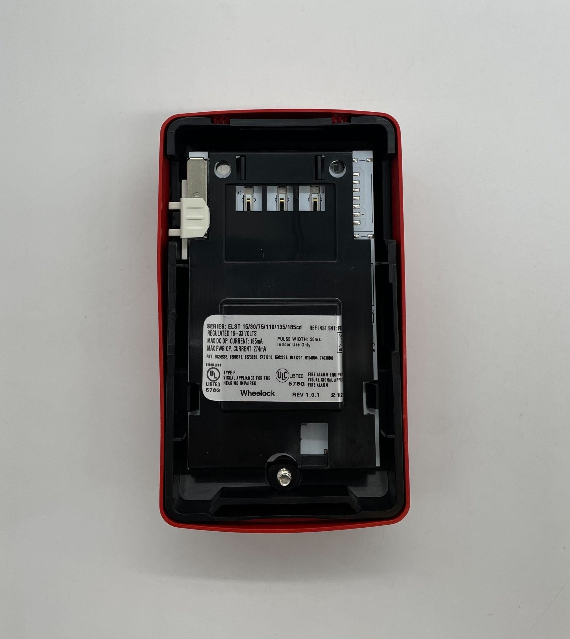 Eaton Wheelock ELSTR-N strobe light with clear lens and mounting bracket, designed for emergency signaling and alert systems.