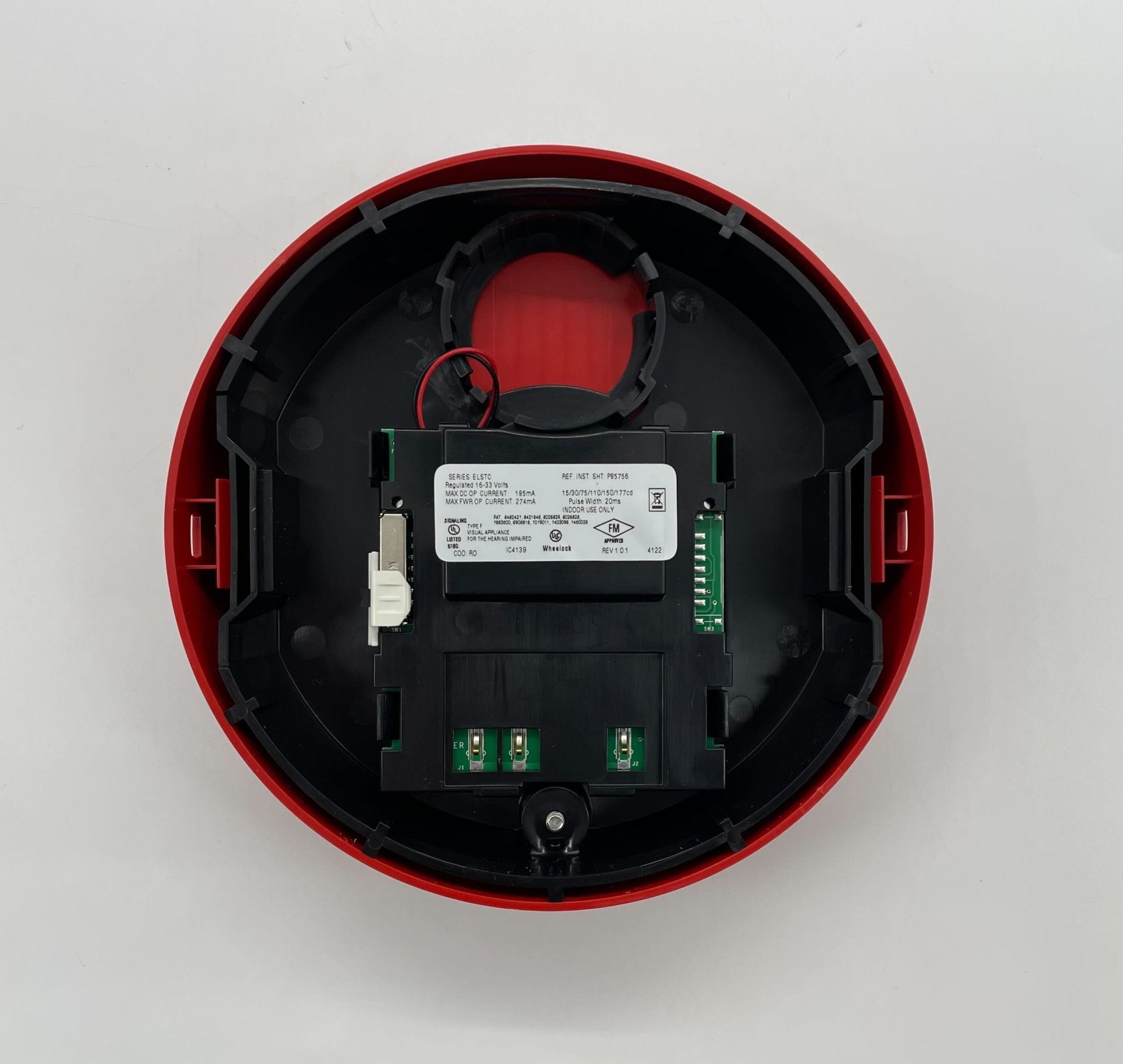 Eaton Wheelock ELSTRC strobe light with clear lens and mounting bracket, used for visual signaling and emergency alerts.