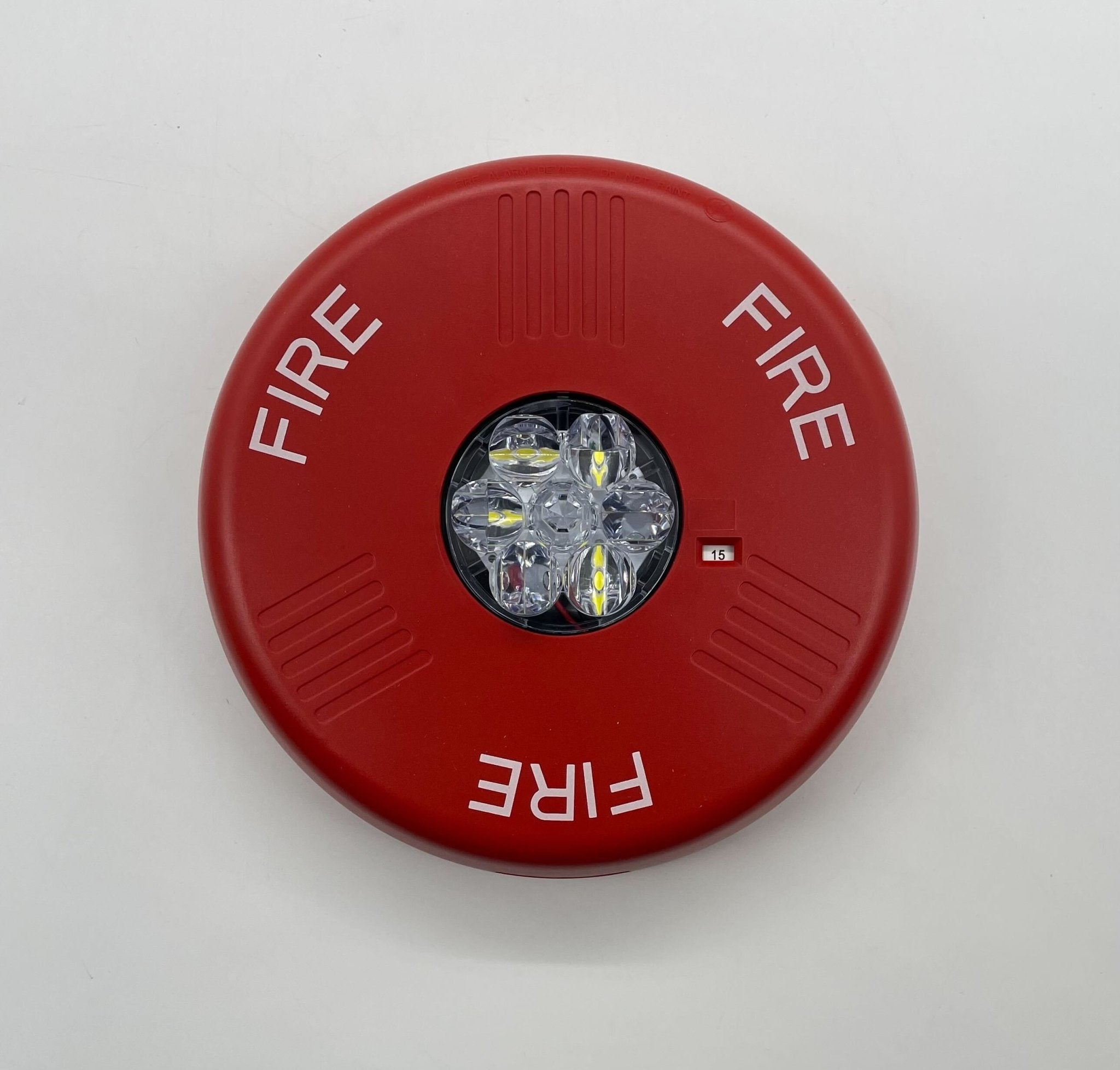 Eaton Wheelock ELSTRC strobe light fixture with clear lens and mounting hardware for emergency signaling applications.