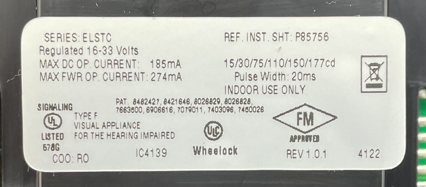 Eaton Wheelock ELSTRC strobe light mounted on a ceiling, designed for emergency and warning signaling.