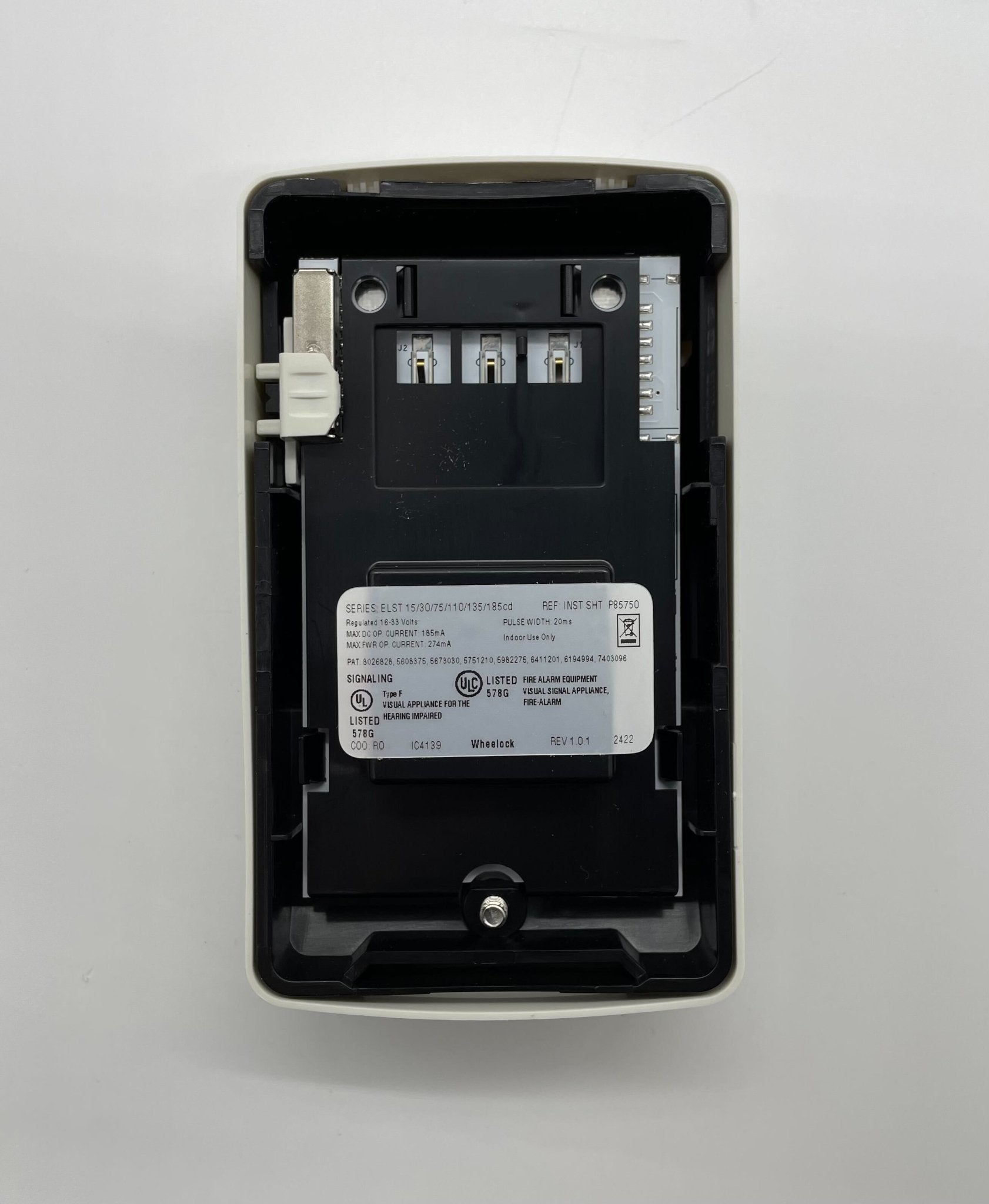 Eaton Wheelock ELSTW strobe light with Jem Systems Canada label, mounted on a ceiling for emergency warning illumination.