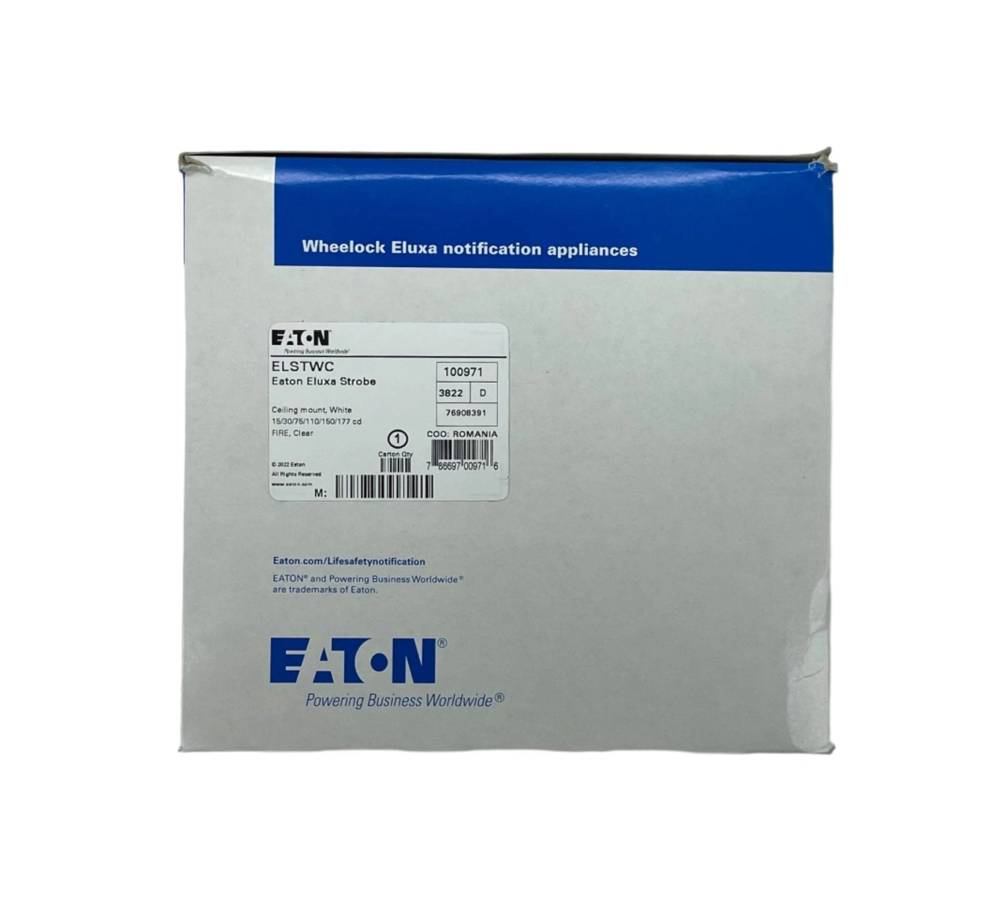 Eaton Wheelock ELSTWC strobe light with clear casing and mounting bracket, designed for emergency signaling and alert systems.