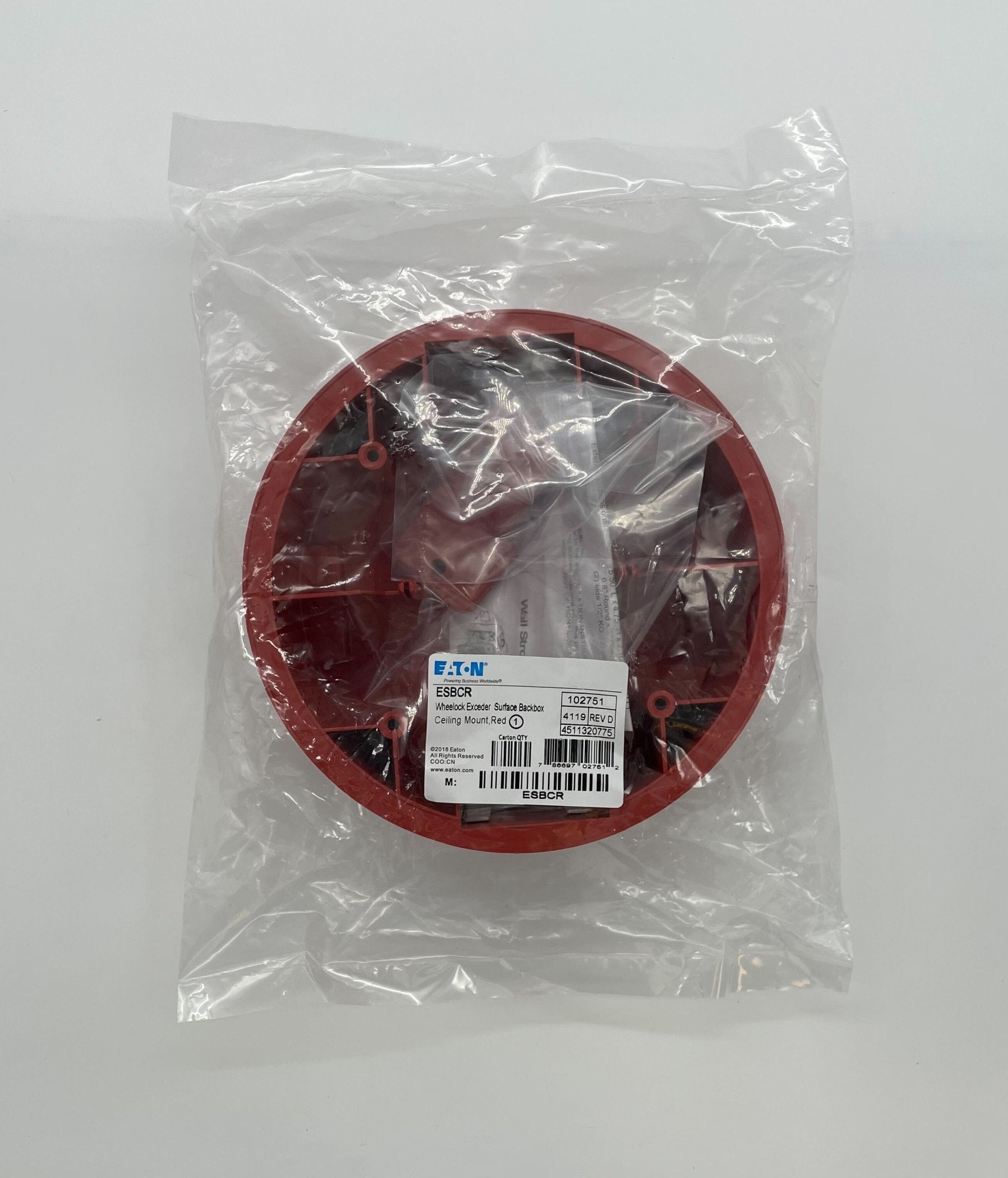 Eaton Wheelock ESBCR fire alarm with red alarm horn and mounting bracket, designed for emergency warning systems.