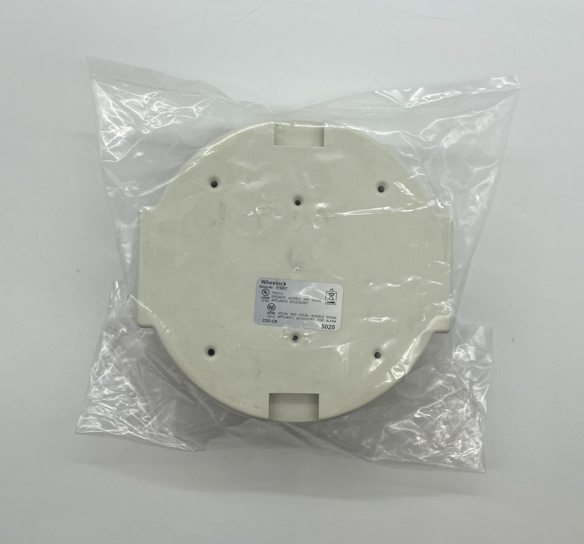 Eaton Wheelock ESBCW fire alarm with black casing and mounting bracket, designed for fire safety systems.